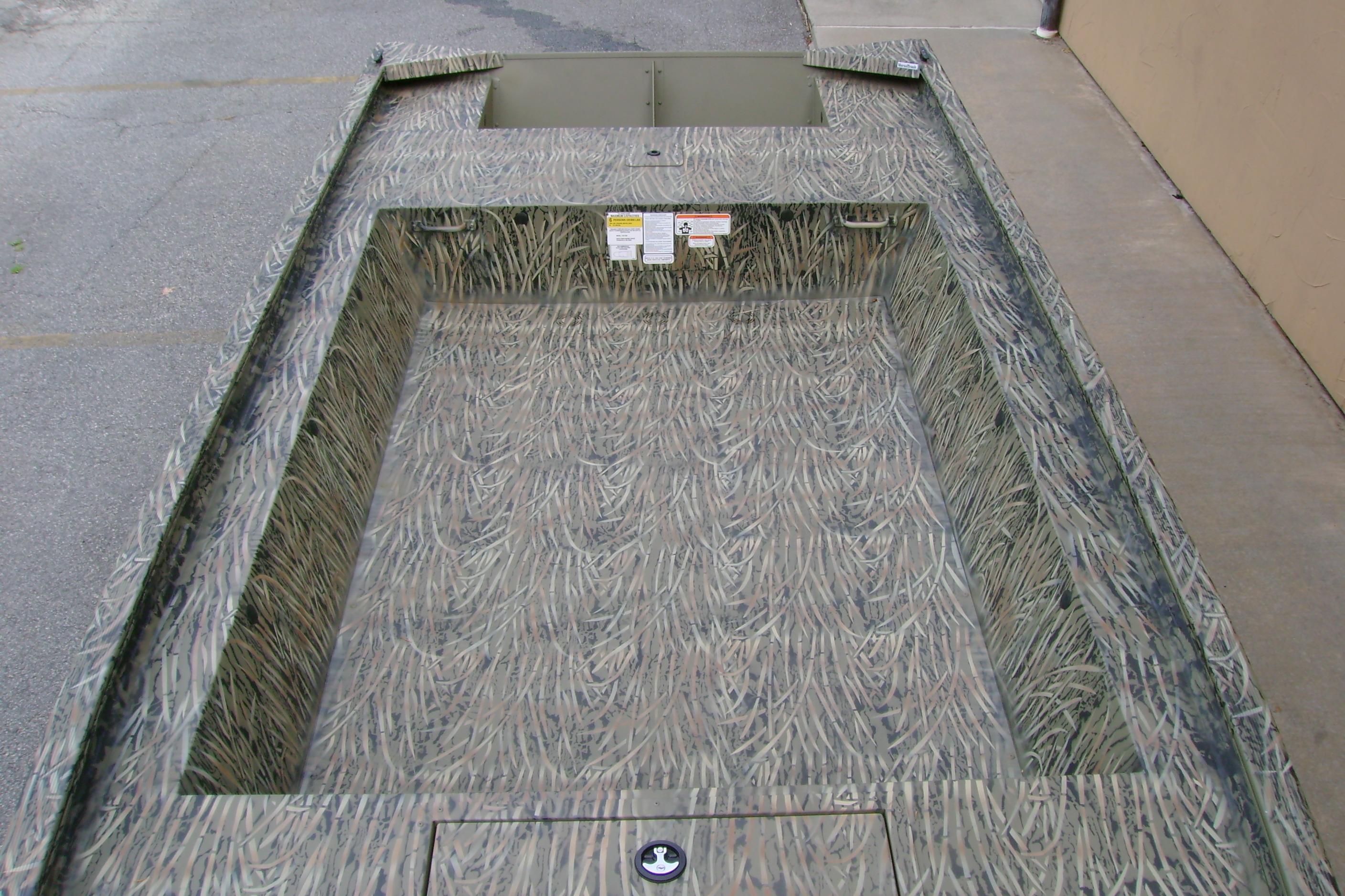 2026 Tracker Grizzly 1754 Utility boat with camouflage interior design.