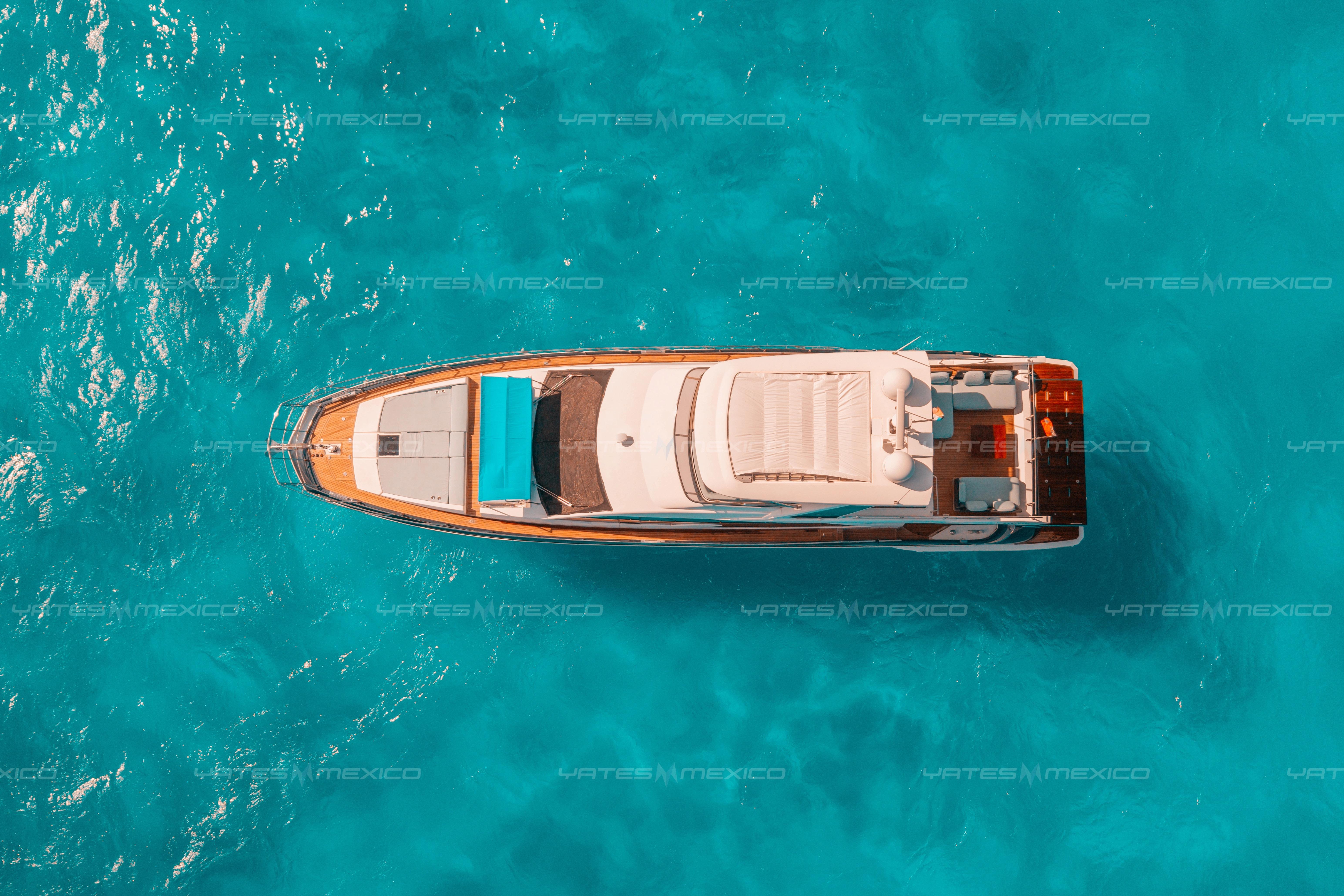 Aerial view of 2017 Azimut 66 yacht on turquoise water.