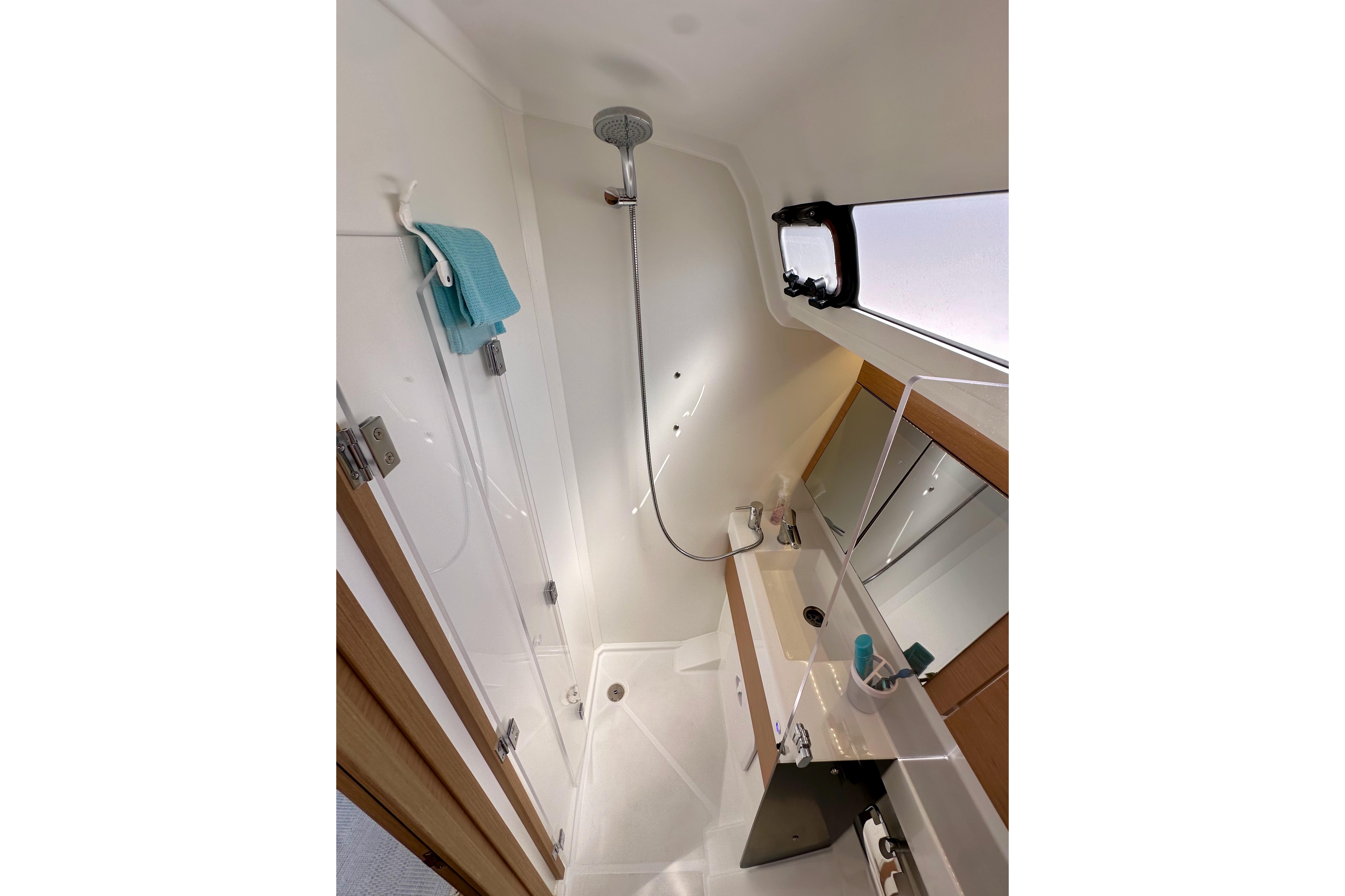2024 Jeanneau Sun Odyssey 410 bathroom with modern shower and sink.