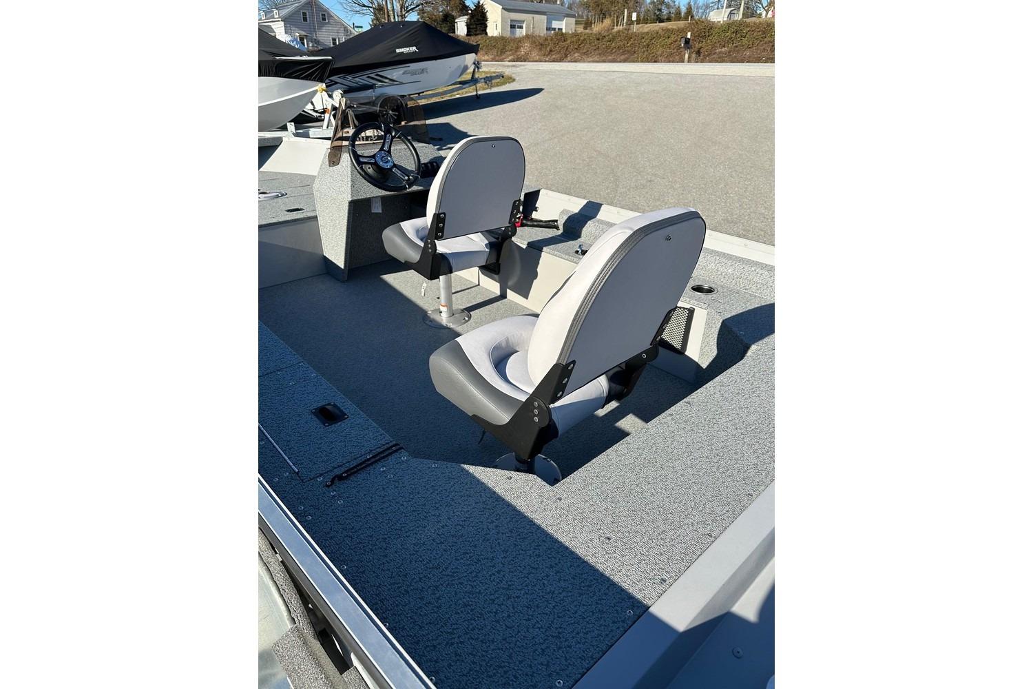 2026 Smoker Craft Angler 16 SC boat interior with two seats and steering console.