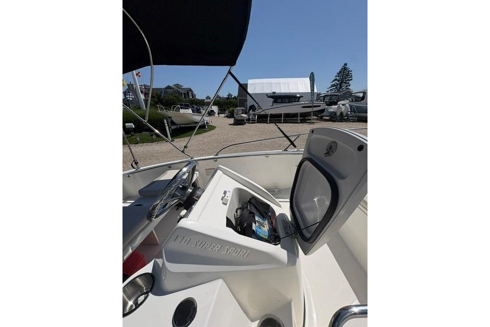 2024 Boston Whaler 130 Super Sport boat interior with open storage compartment.