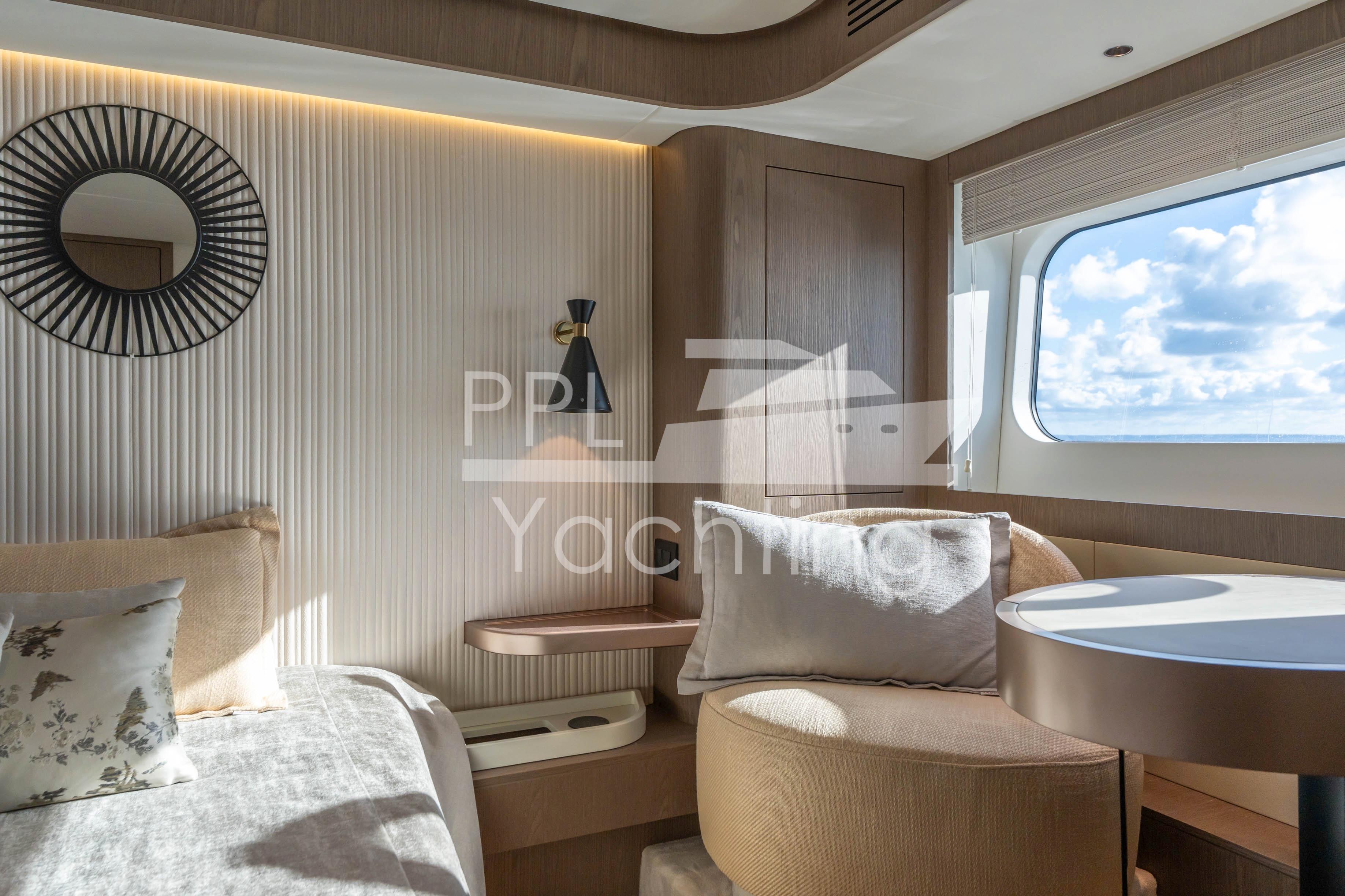 Luxurious interior of 2021 Azimut Magellano 66 yacht with elegant decor and ocean view.