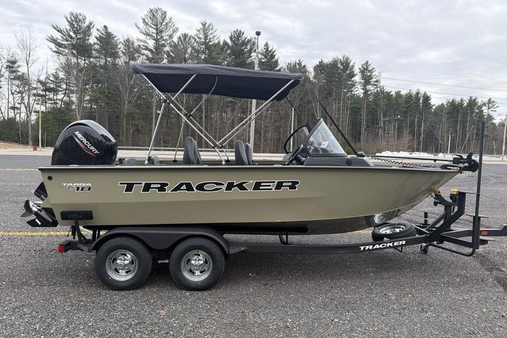 2026 Tracker Targa V-18 Combo boat on trailer, parked outdoors.