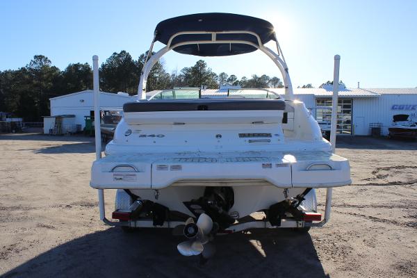 2016 Sea Ray 240 Sundeck boat, rear view, parked outdoors under clear sky.