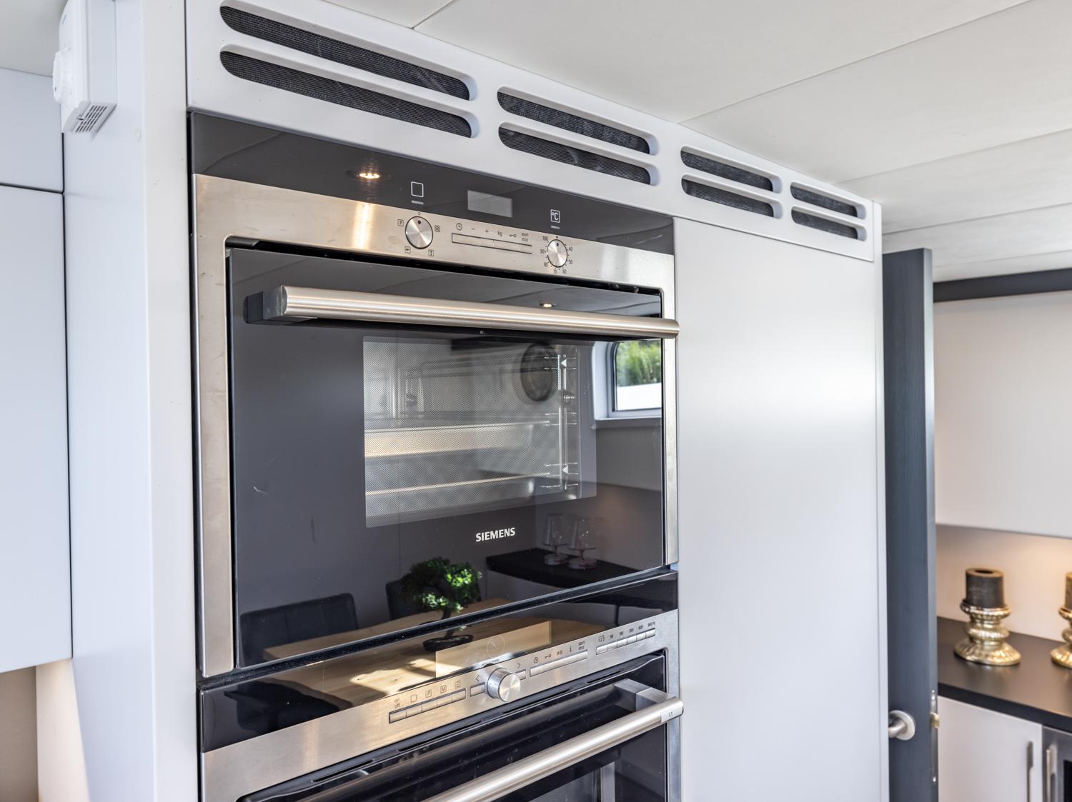 Modern kitchen with Siemens oven in Bekebrede Luxemotor 19.95 yacht, 2013 model.