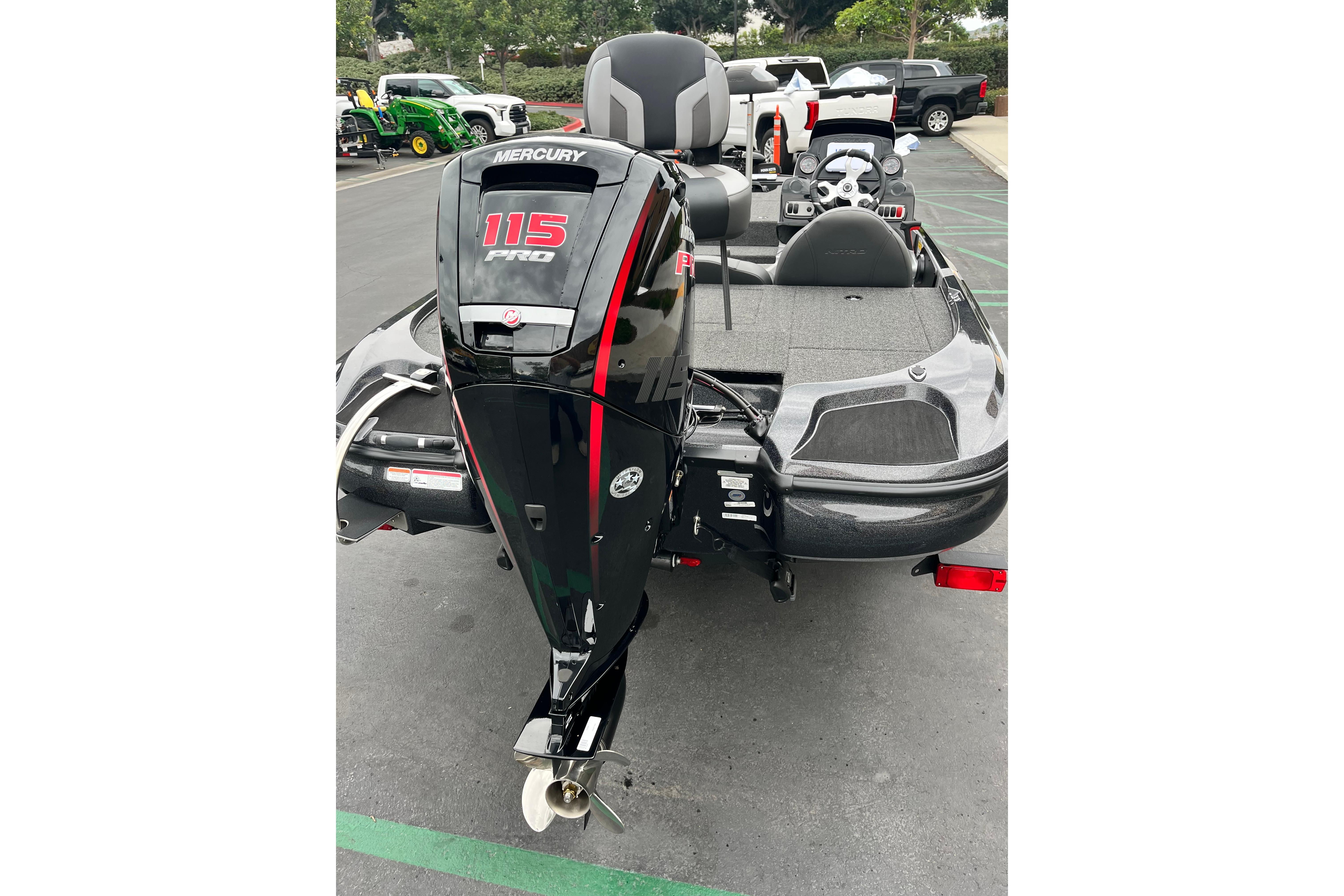 2026 Nitro Z17 boat with Mercury 115 Pro outboard motor in parking lot.