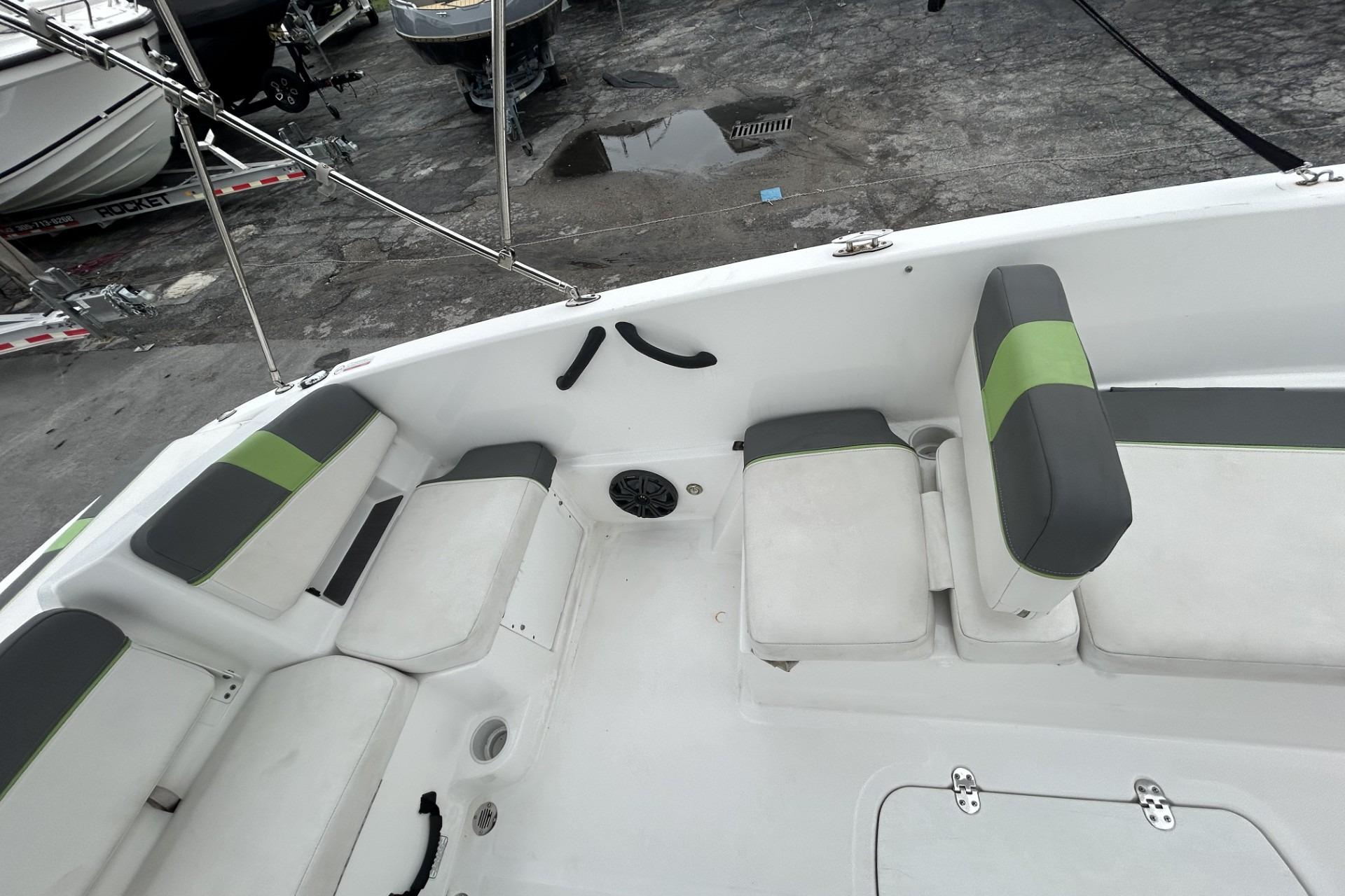 Interior of a 2022 Tahoe T18 boat with gray and green seating.