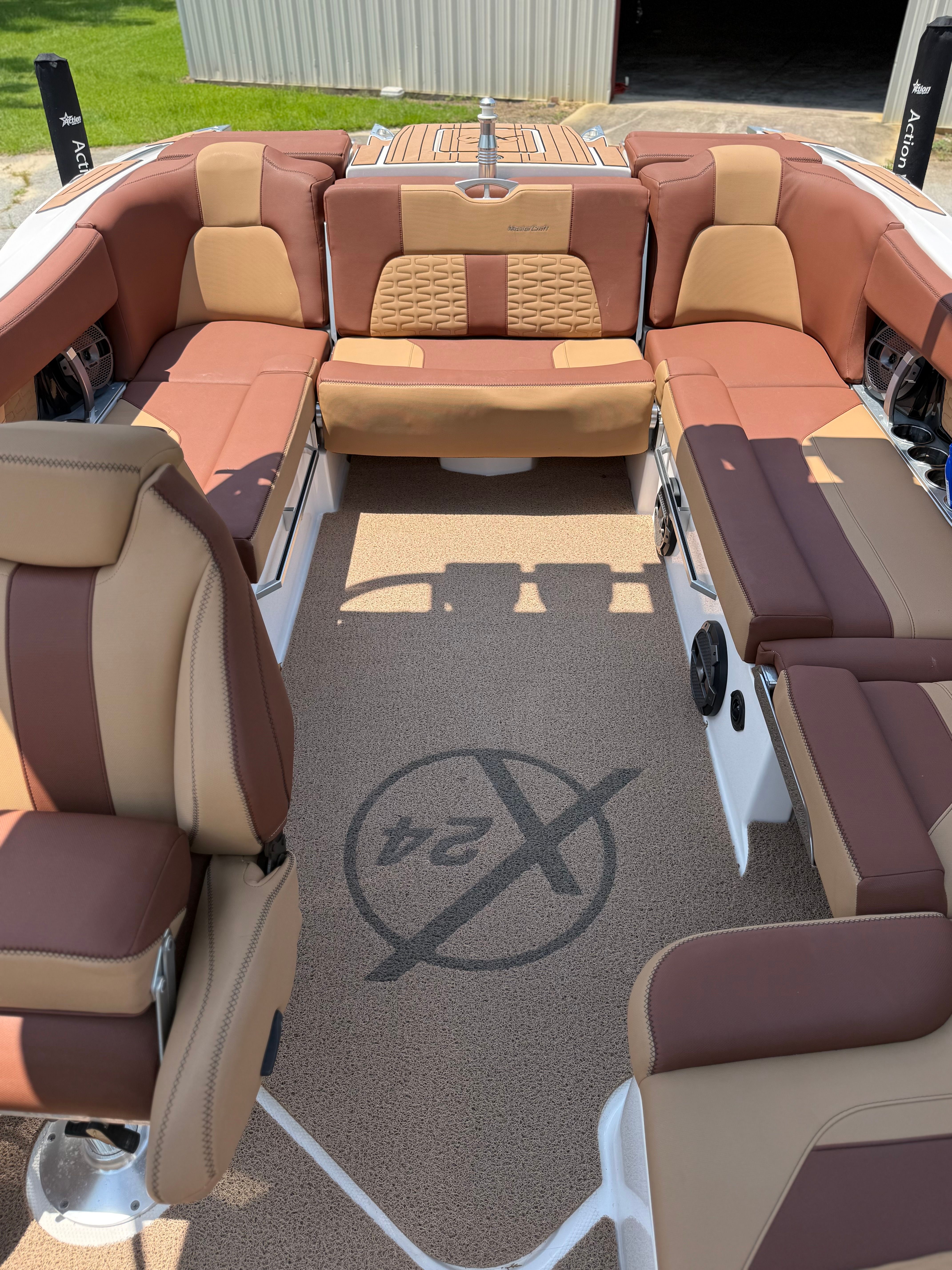 Interior of a 2021 MasterCraft X24 with brown and beige seating.