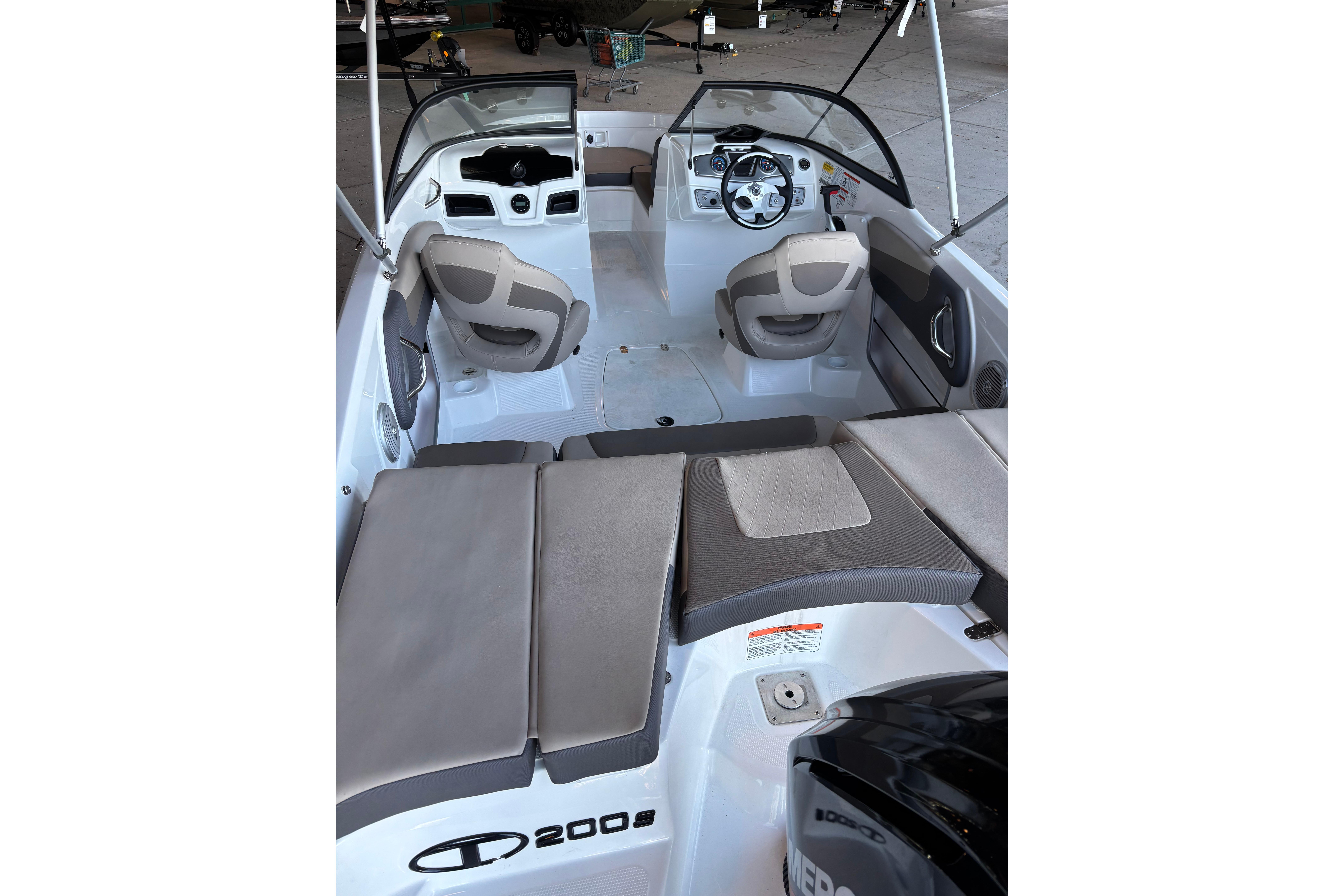 Interior of 2025 Tahoe 200 S boat with seating and steering wheel.