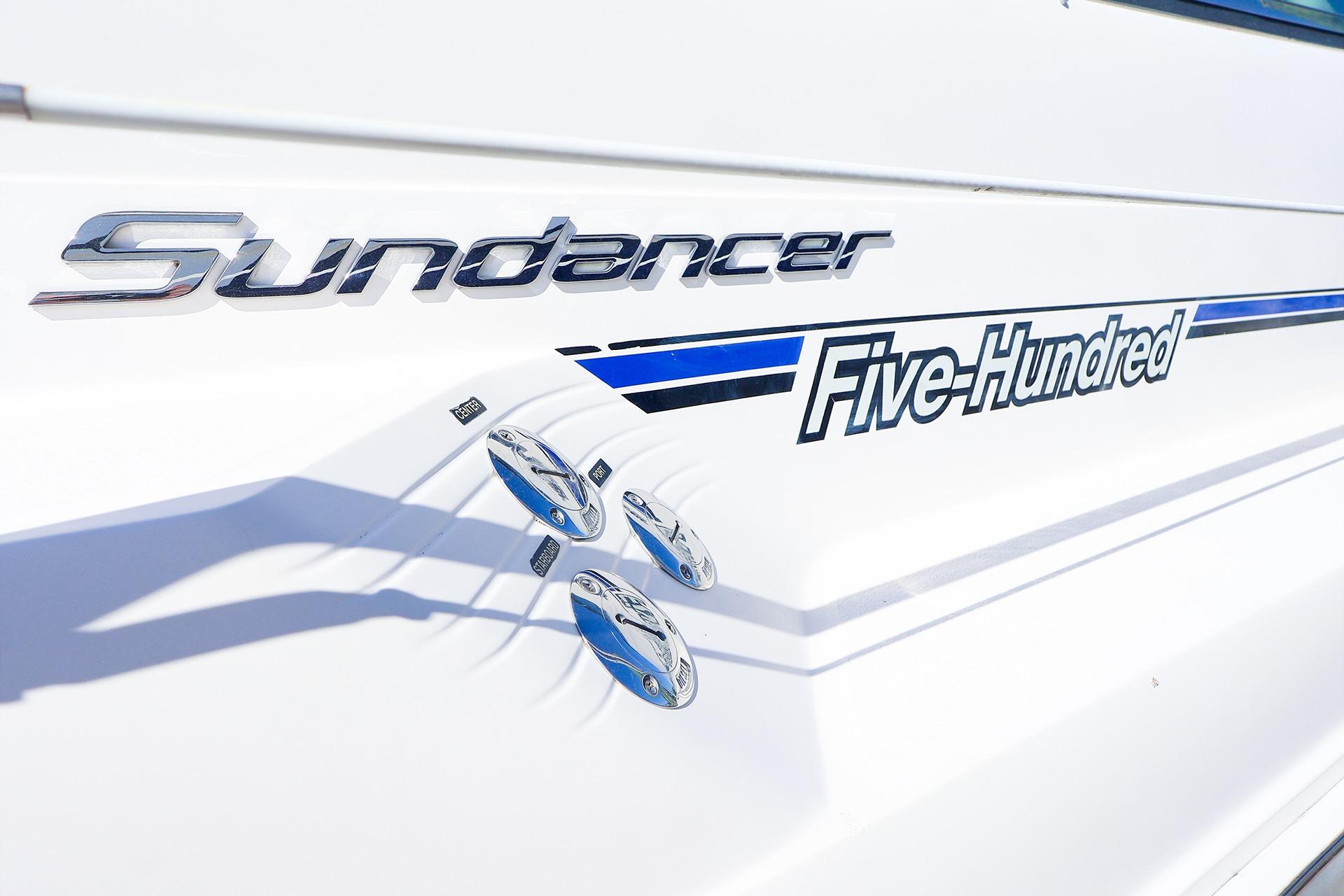 1998 Sea Ray 500 Sundancer boat emblem with sleek design and chrome accents.