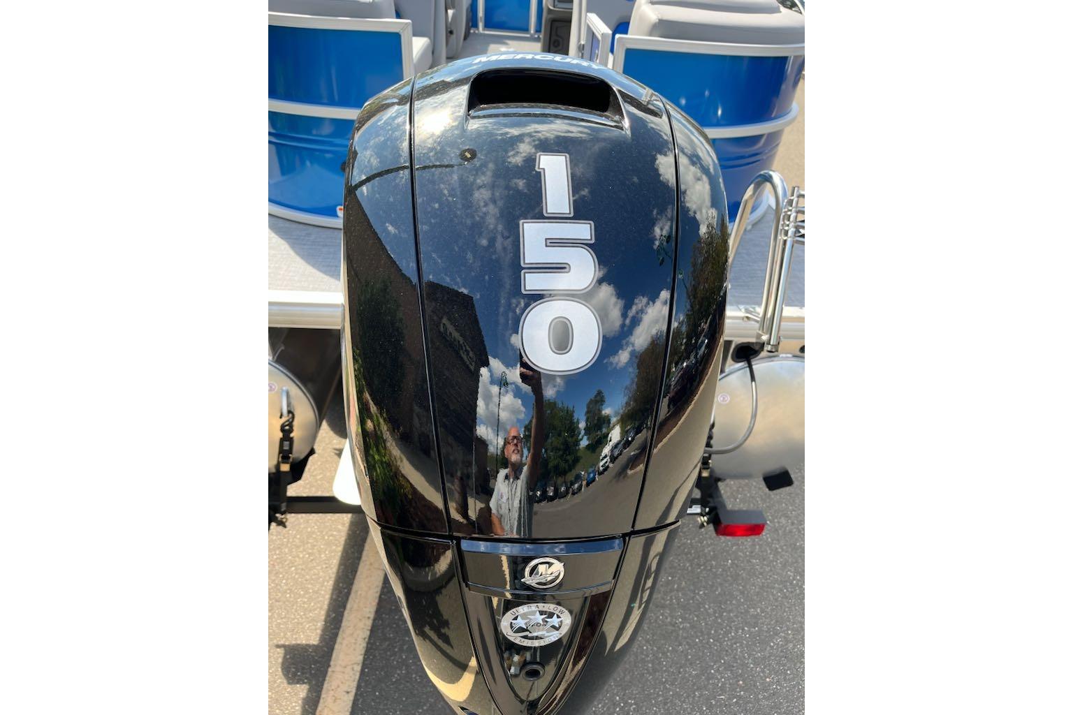 2026 Sun Tracker Party Barge 22 DLX with 150 HP outboard motor.