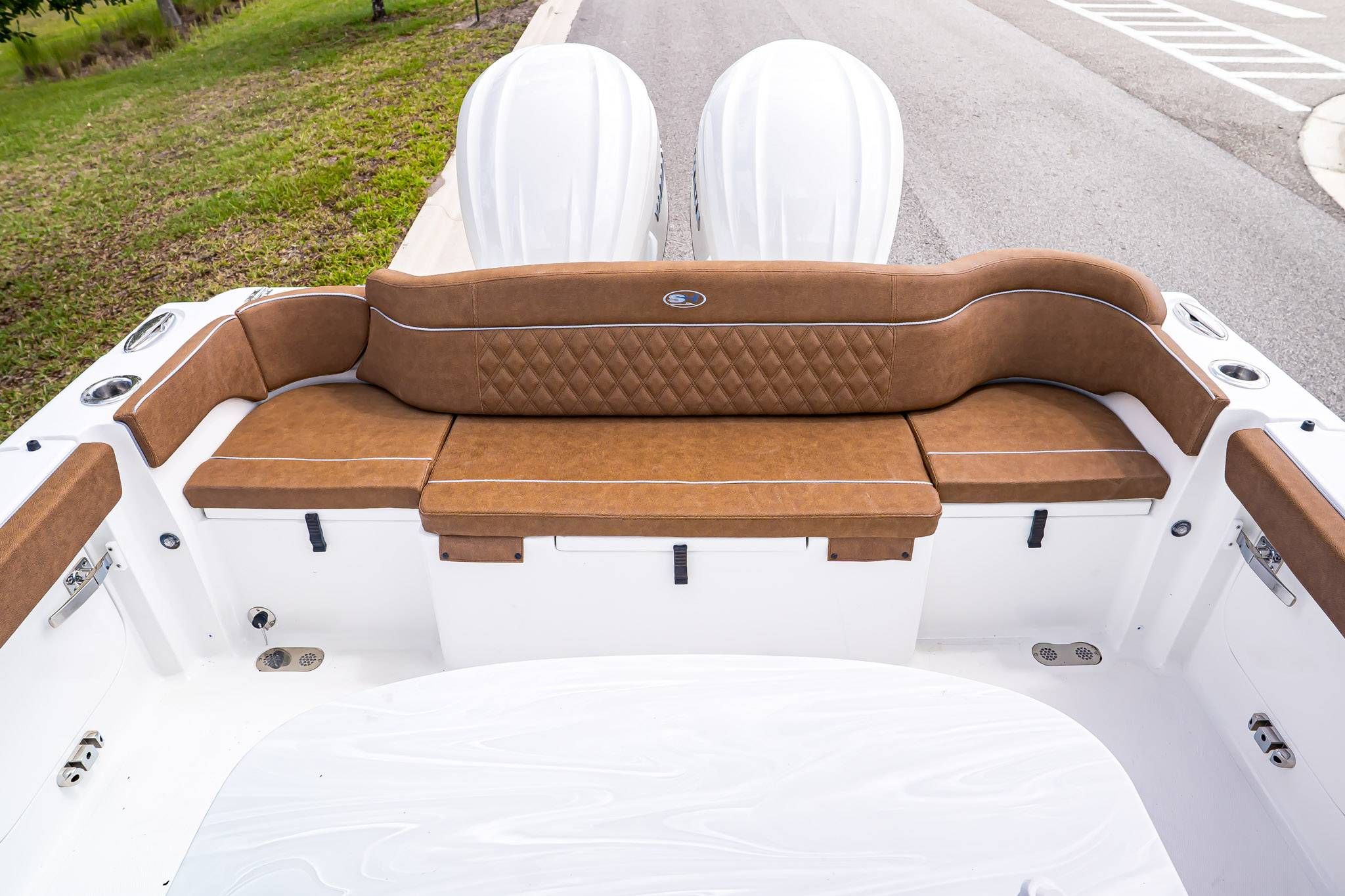 Rear seating of 2026 Sea Hunt ULTRA 285CB with brown upholstery.