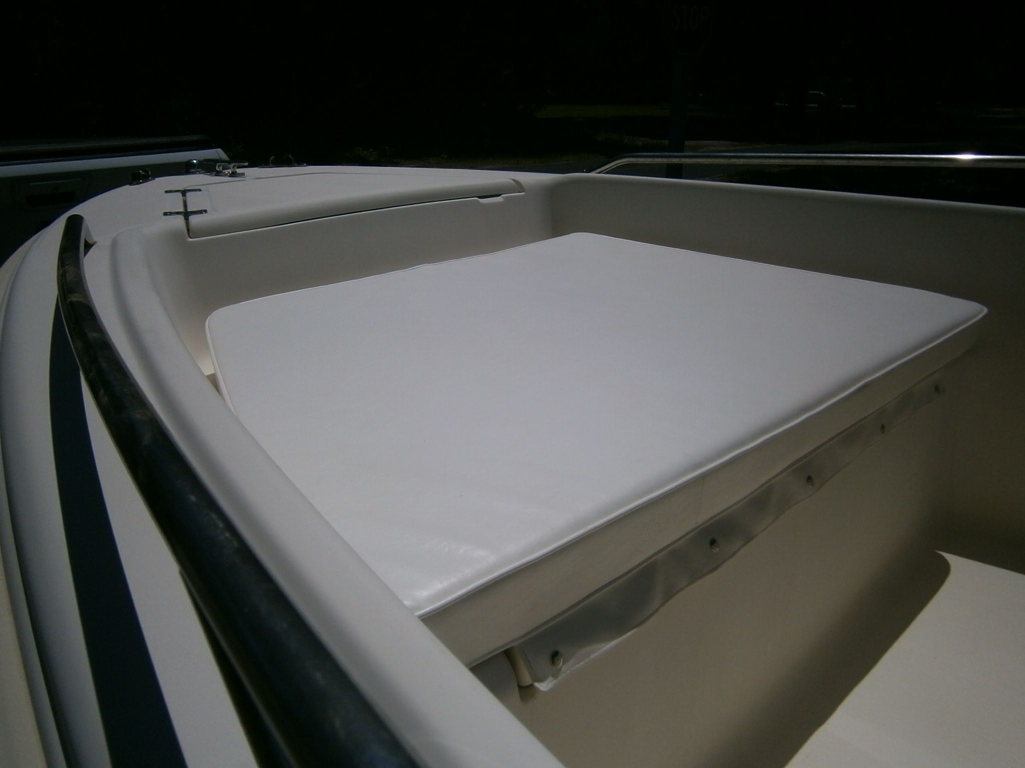Scout 175 Sportfish 2004 boat with cushioned seating area.
