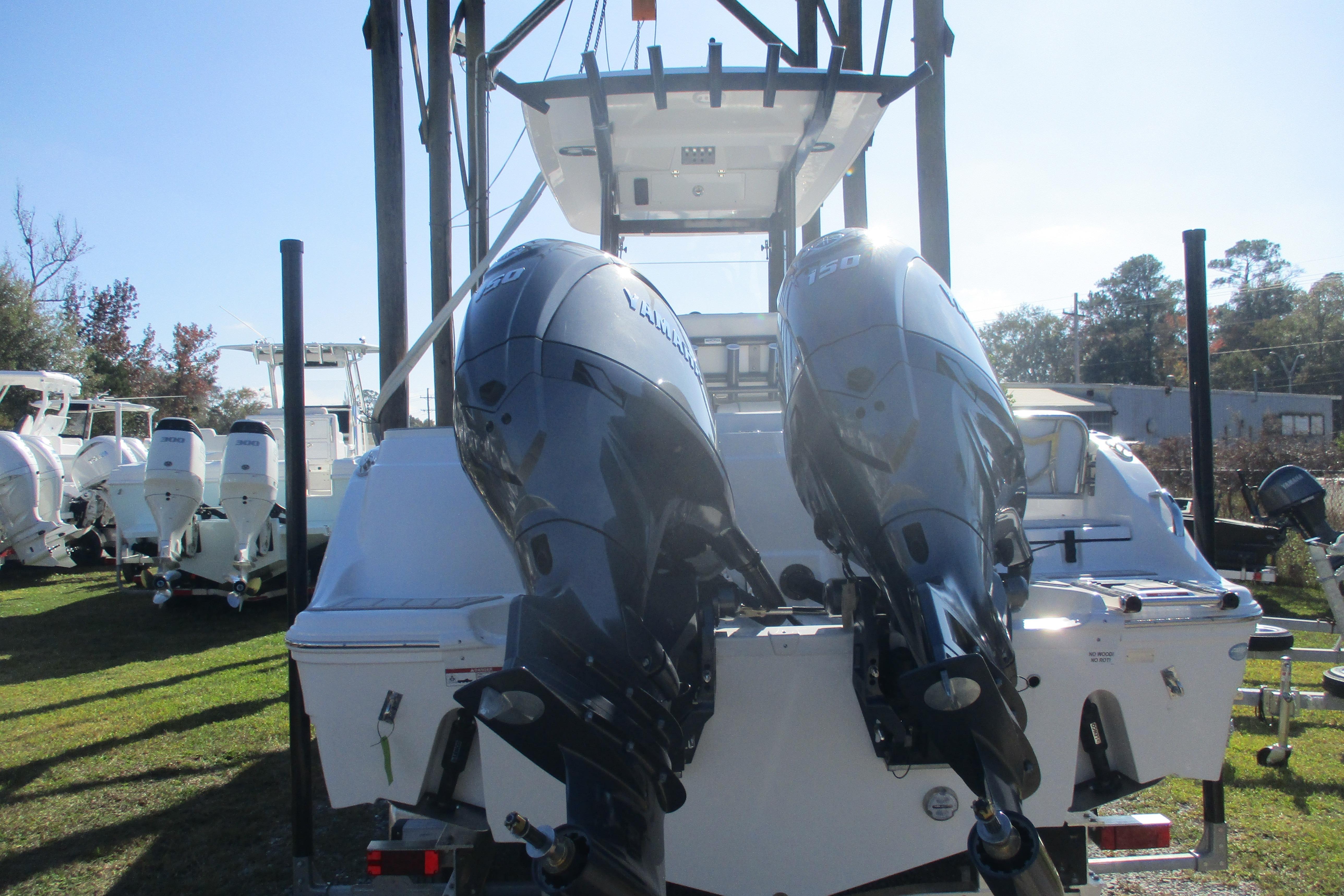 2026 Sea Fox 268 Commander boat with dual outboard engines, displayed outdoors.