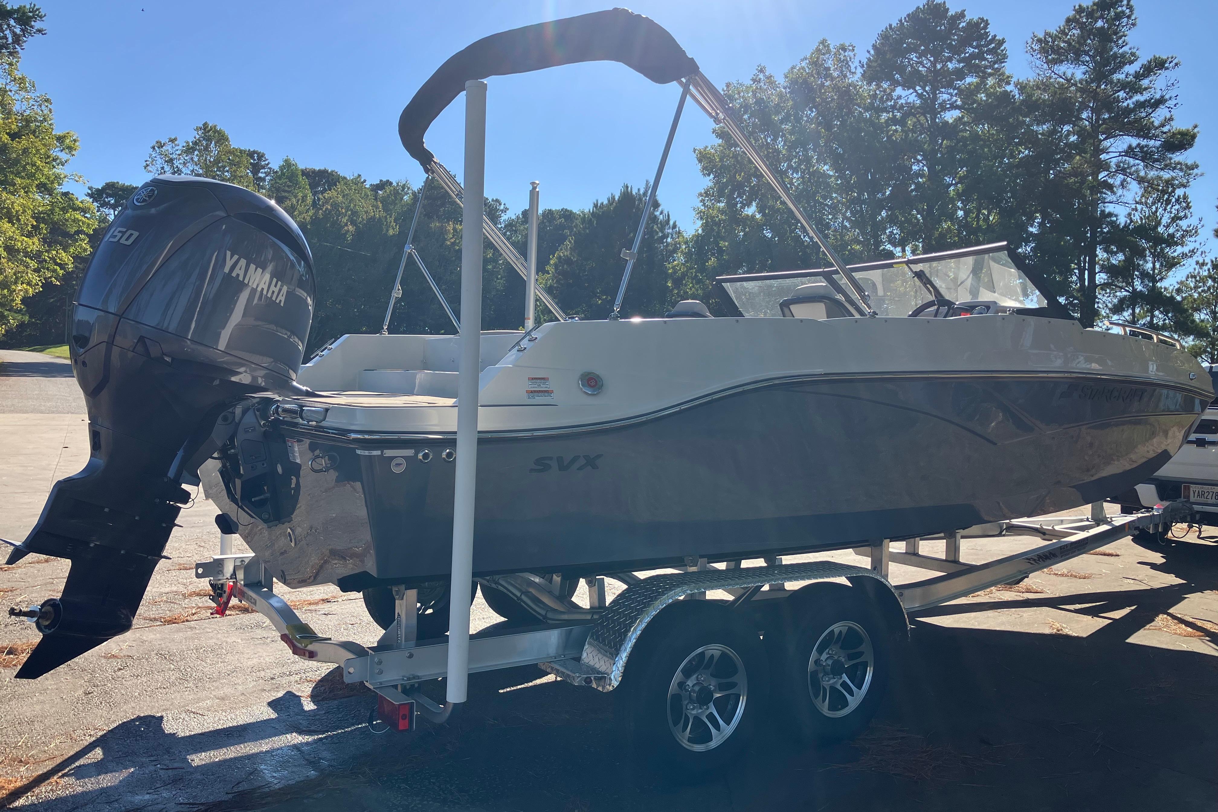 2025 Starcraft SVX 210 OB boat on trailer with Yamaha outboard motor.