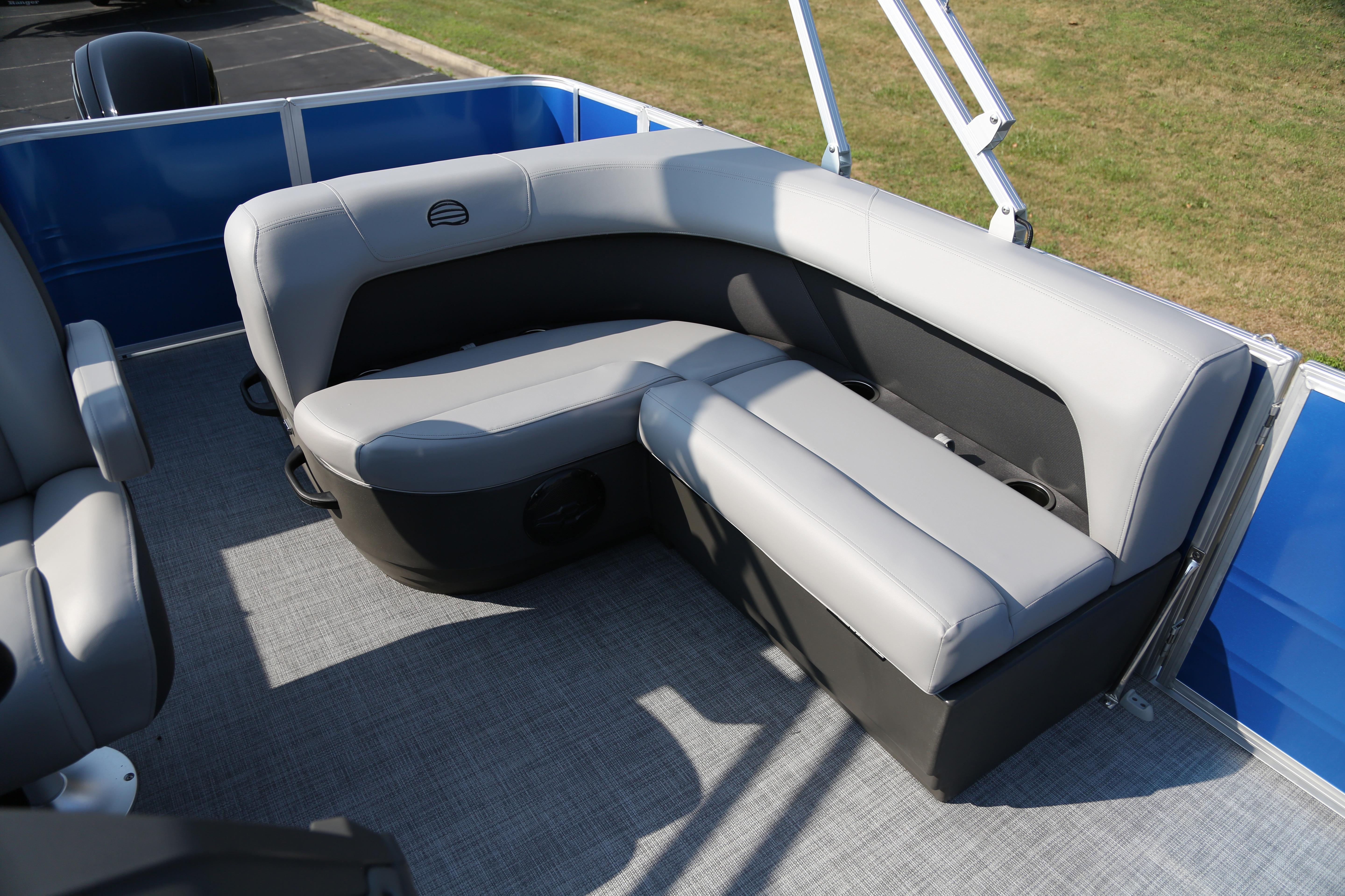 2026 Sun Tracker Party Barge 18 DLX interior seating with gray upholstery.