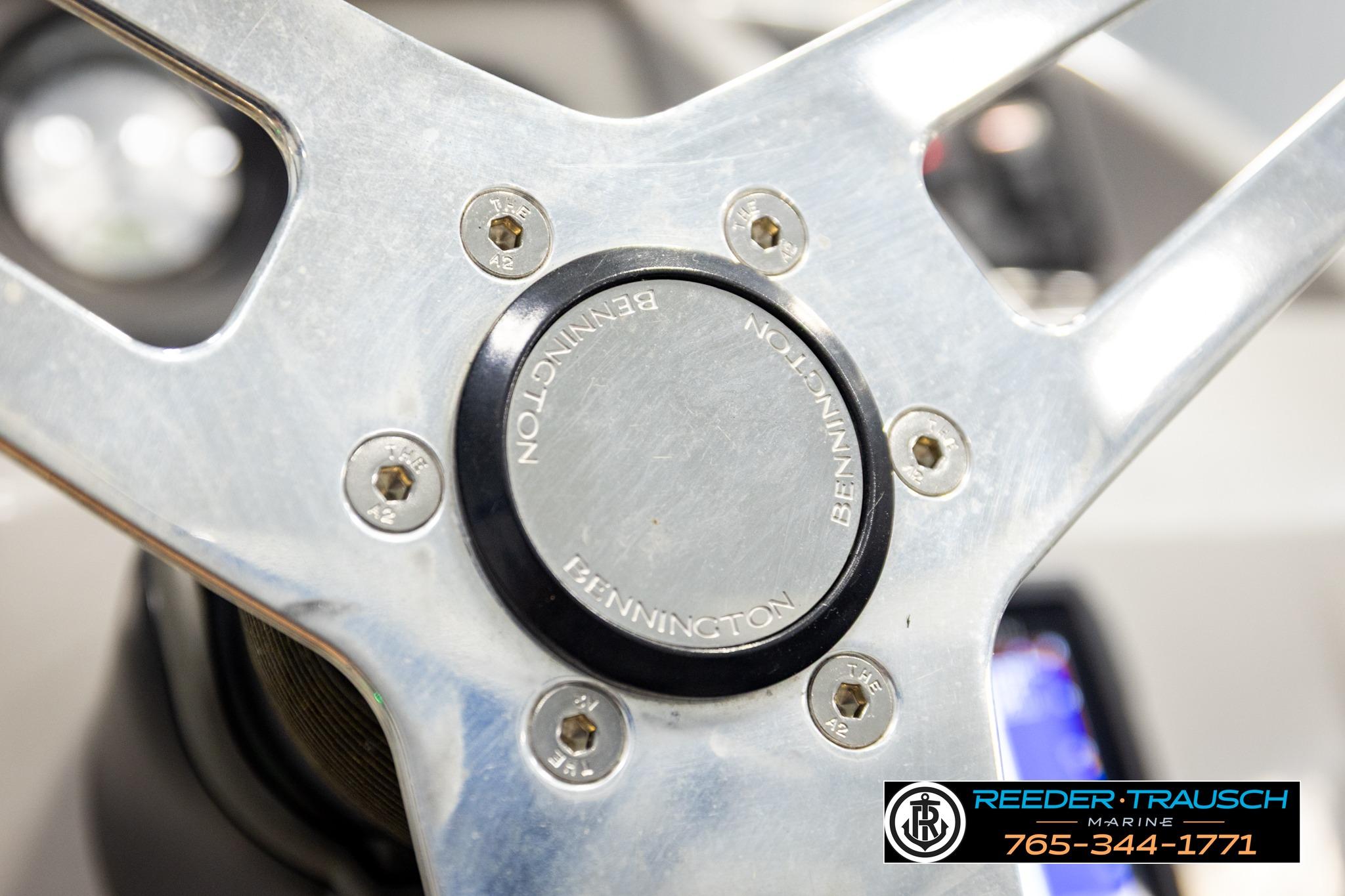 Steering wheel of 2021 Bennington 20 SV boat, featuring Reeder Trausch Marine logo.