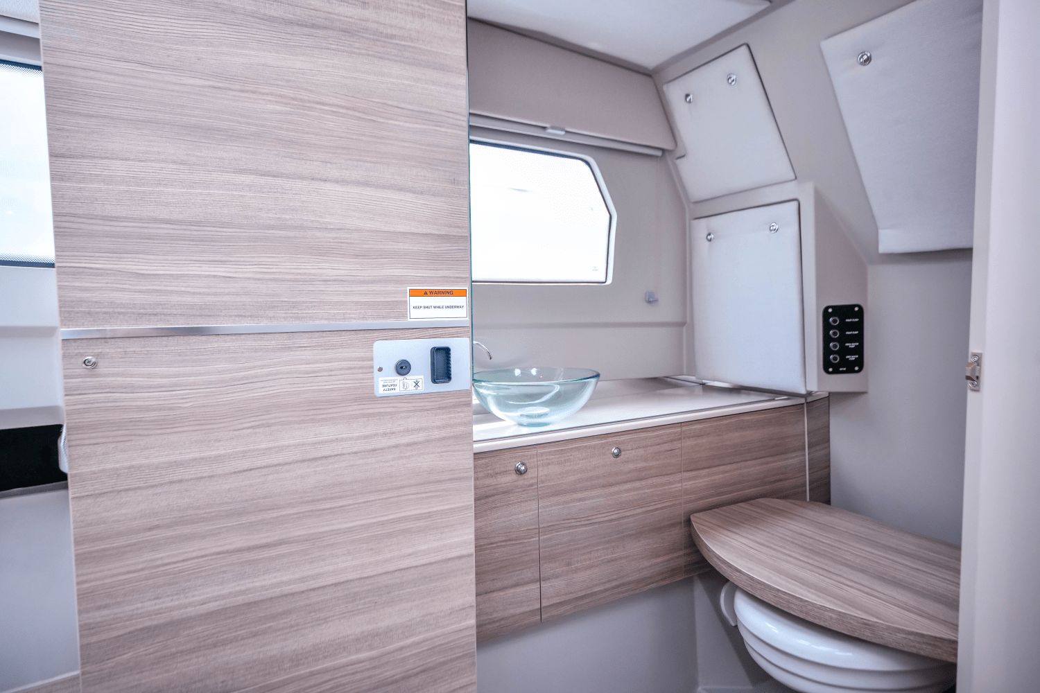 Interior of the 2027 Saxdor SX320 GTO featuring a modern bathroom with a glass sink.
