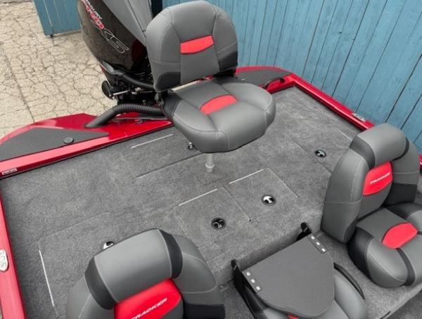 2025 Tracker Savage 215 boat interior with gray and red seating.