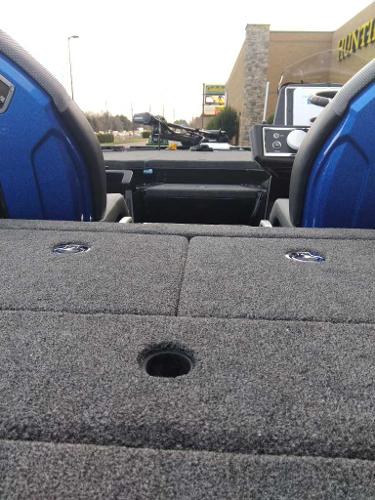 2024 Ranger Z520R Ranger Cup Equipped boat interior with blue seats and carpeted deck.