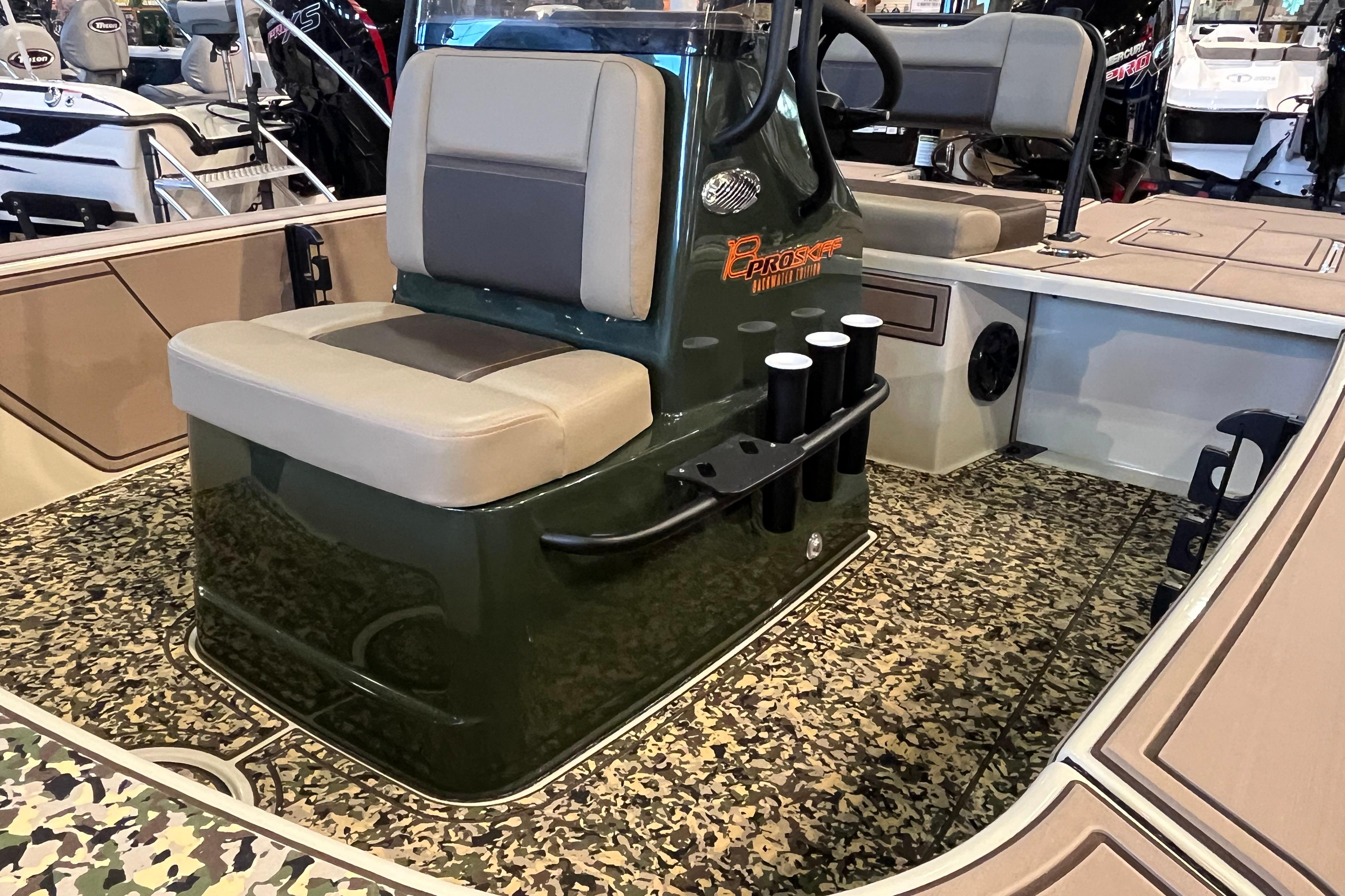 2025 Mako 18 Pro Skiff Backwater Edition interior with camo flooring and seating.