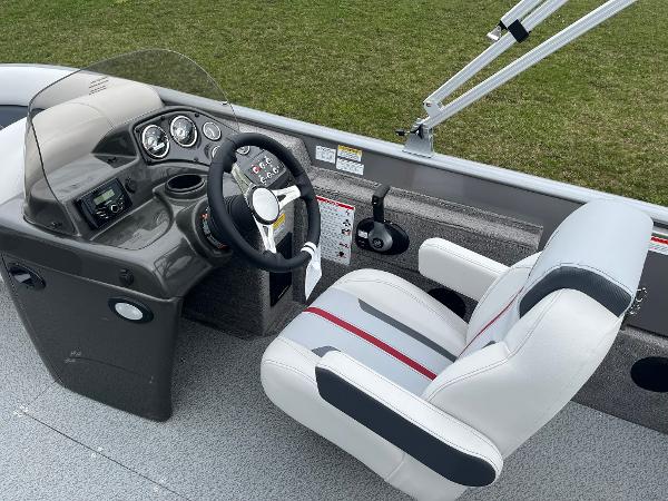 2025 Lowe Deck SD224 boat cockpit with steering wheel, gauges, and comfortable seating.