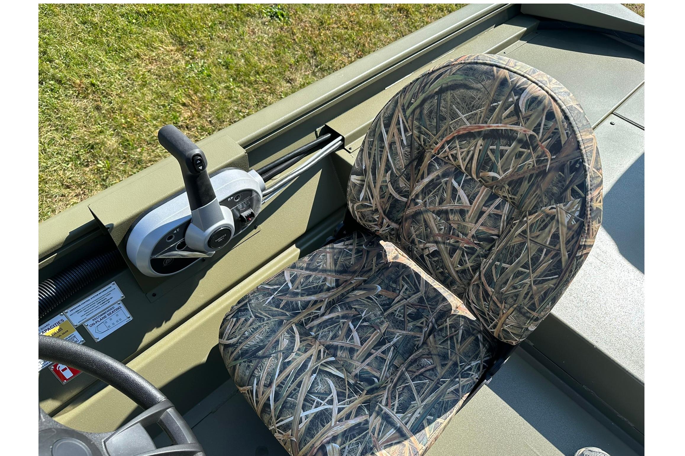 2026 Lowe Roughneck 1860SC boat seat with camouflage pattern and control panel.