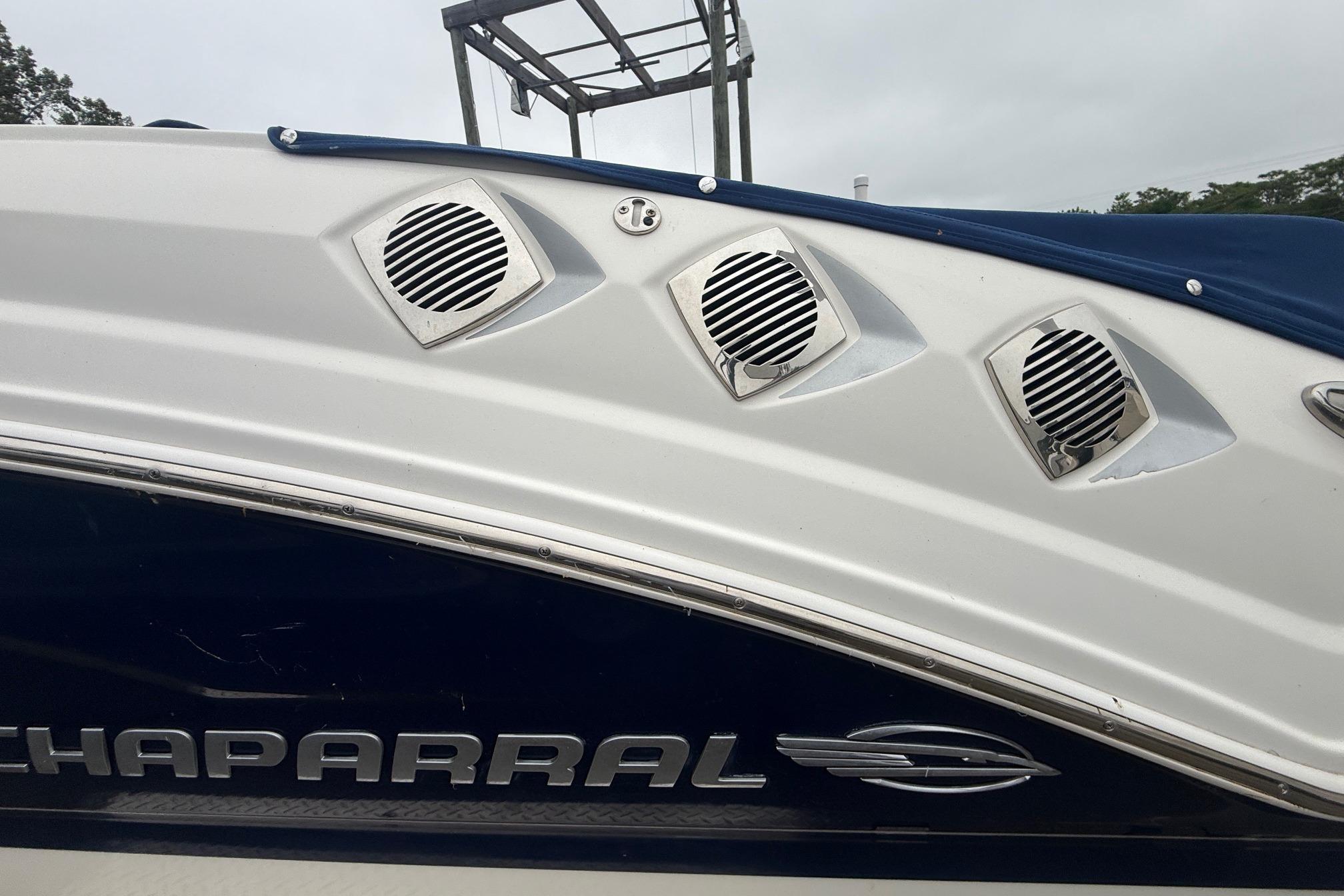 2016 Chaparral 226 SSi Wide Tech boat with sleek design and chrome accents.