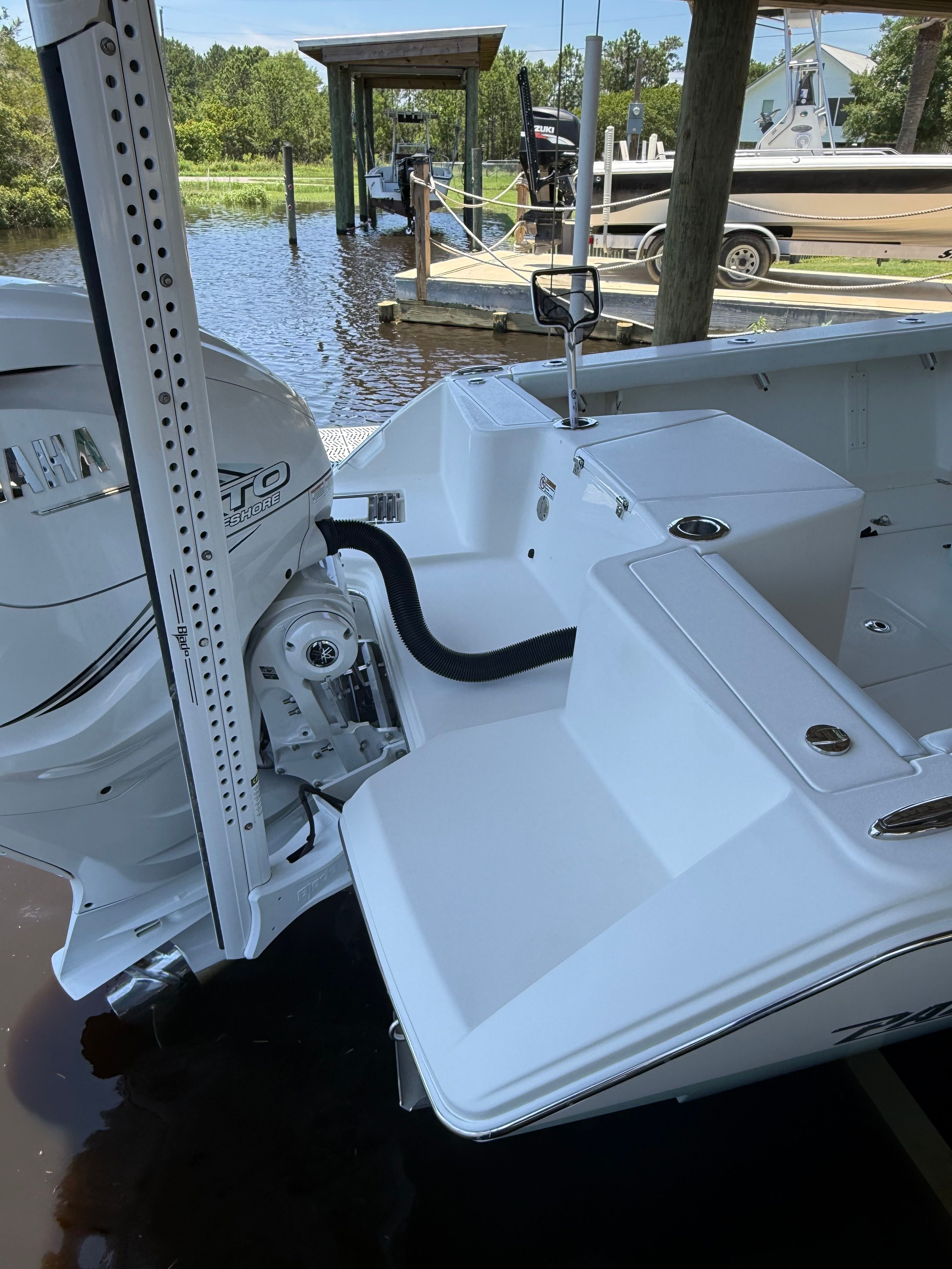 Pathfinder 2700 Open 2024 at dock, engine view.