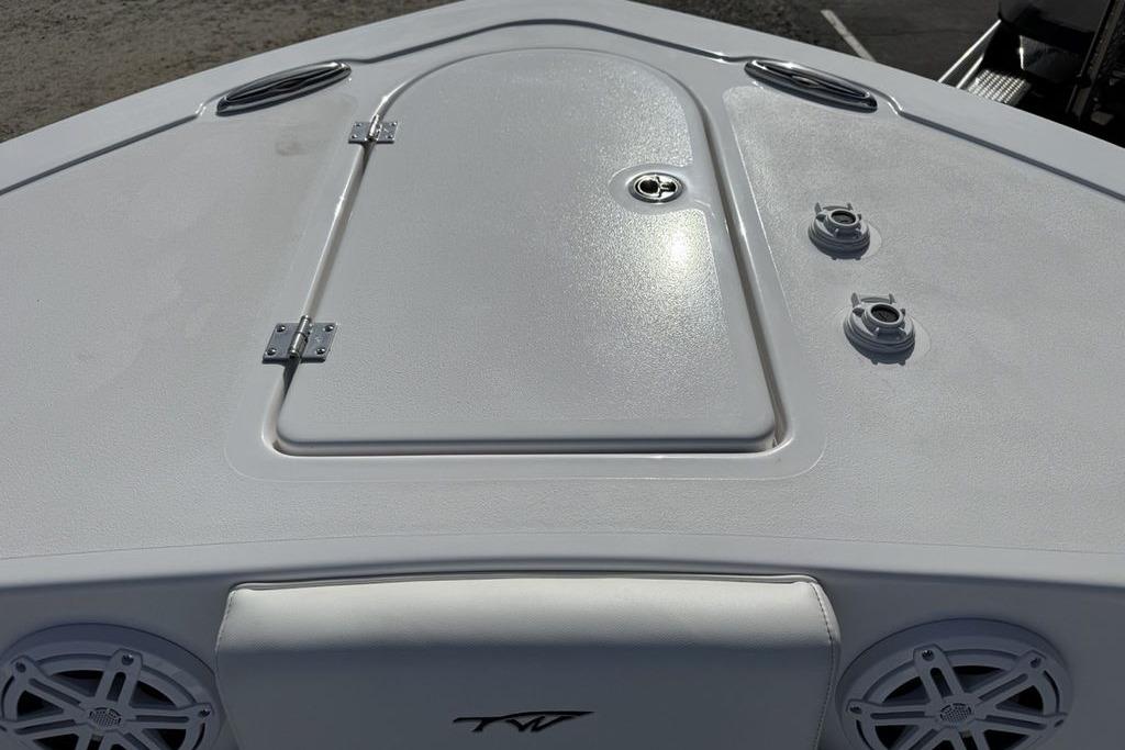 2026 Tidewater 232 LXF boat deck with storage hatch and speakers.