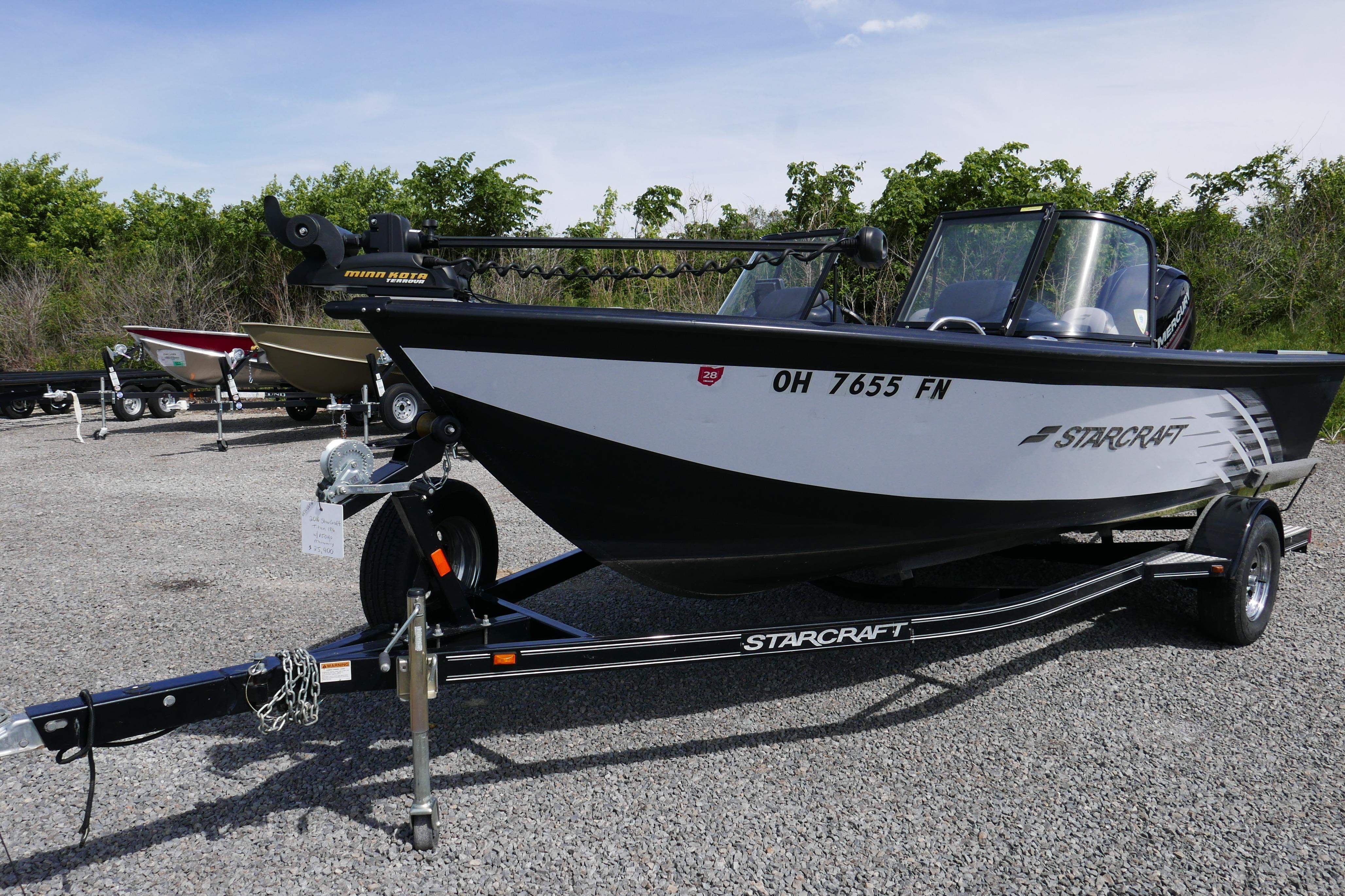 2016 Starcraft Titan 186 boat on trailer, parked outdoors on gravel.