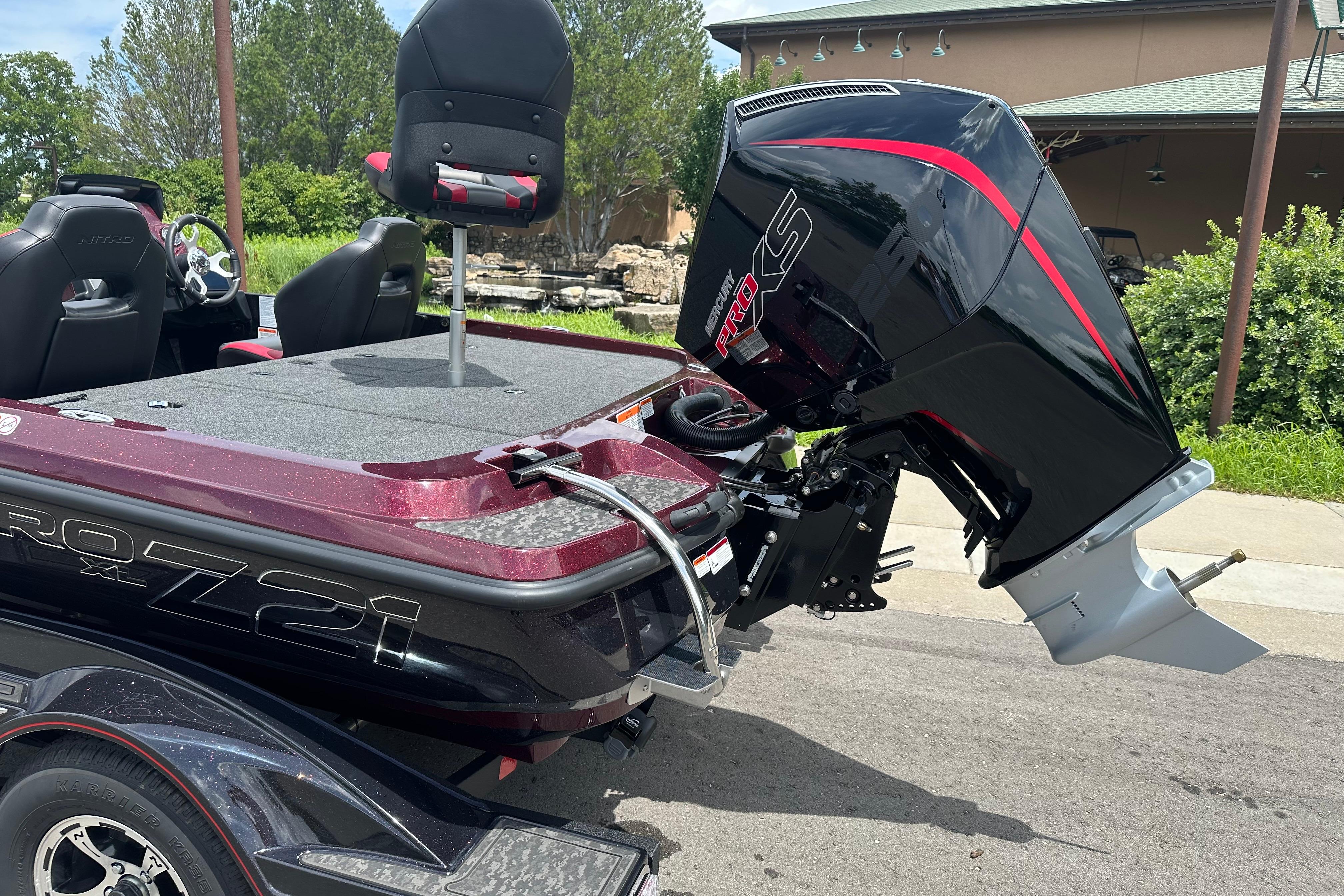 2026 Nitro Z21 XL boat with powerful outboard motor, parked outdoors.