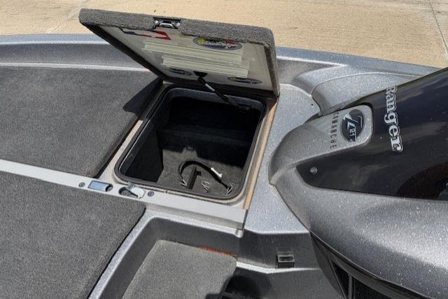Open storage compartment on 2008 Ranger Z21 Comanche boat deck.
