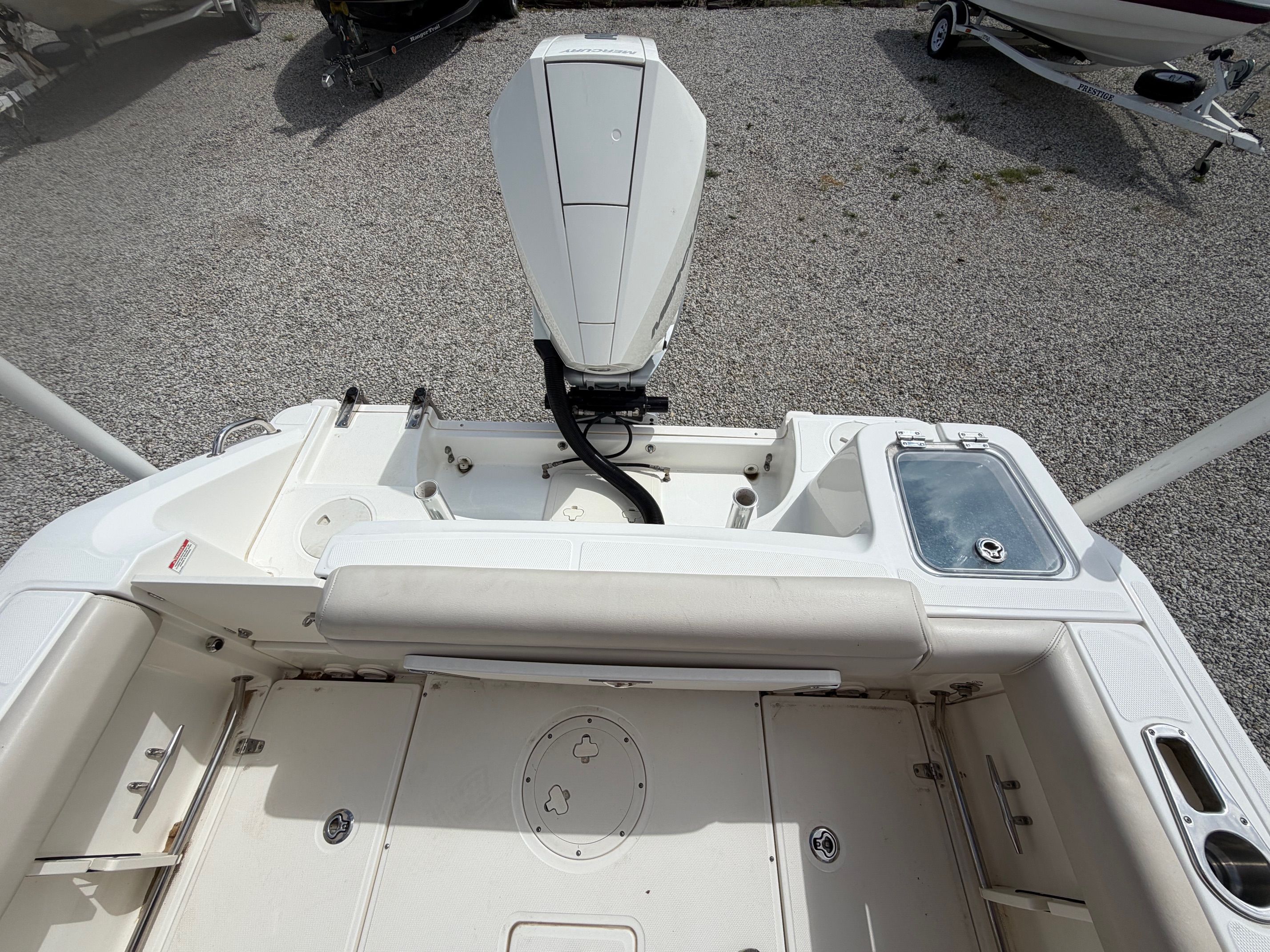 Boston Whaler 230 Outrage 2020 parked on gravel surface.