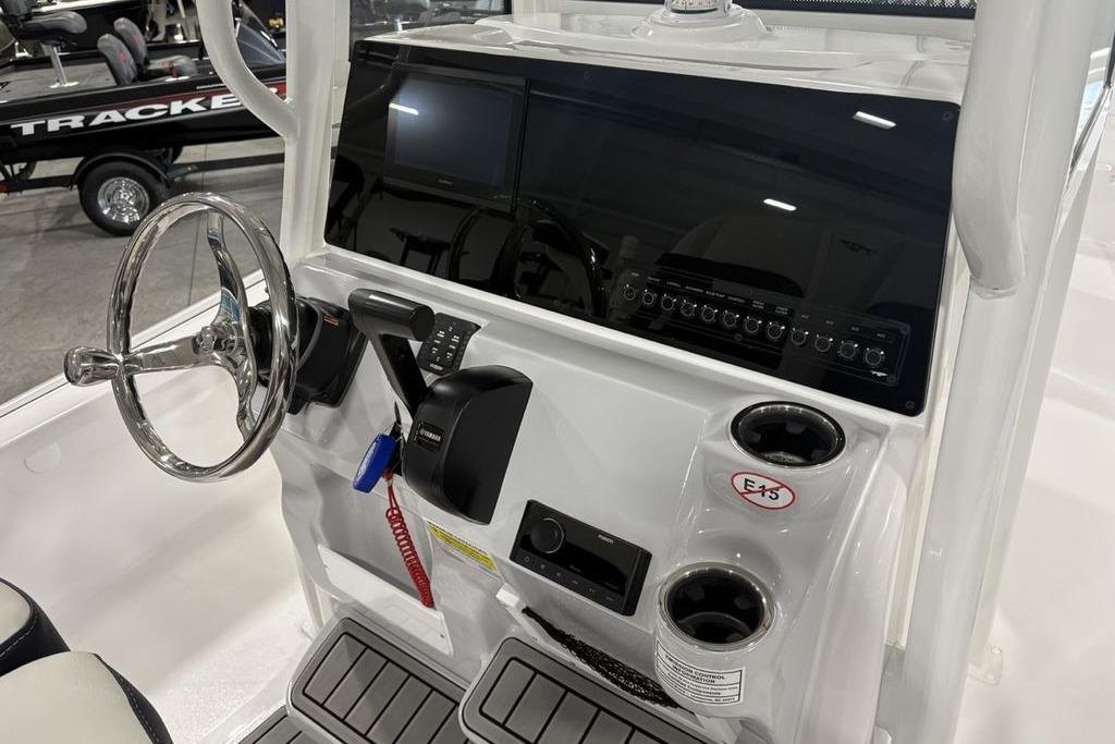 2026 Tidewater 2210 Carolina Bay boat console with steering wheel and controls.
