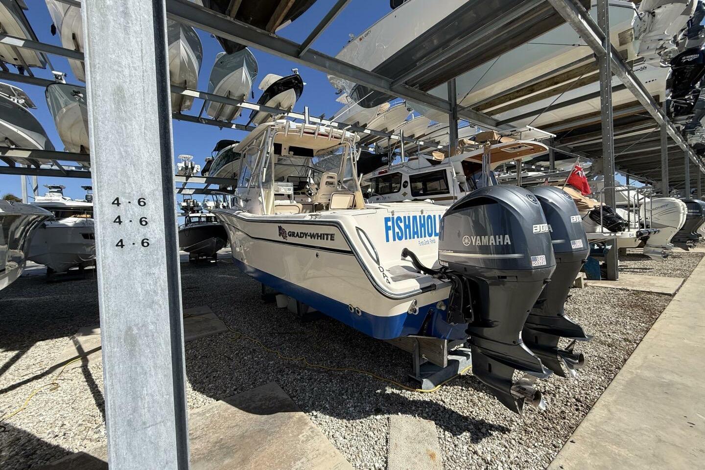 2007 Grady-White Marlin 300 boat with Yamaha engines in storage facility.