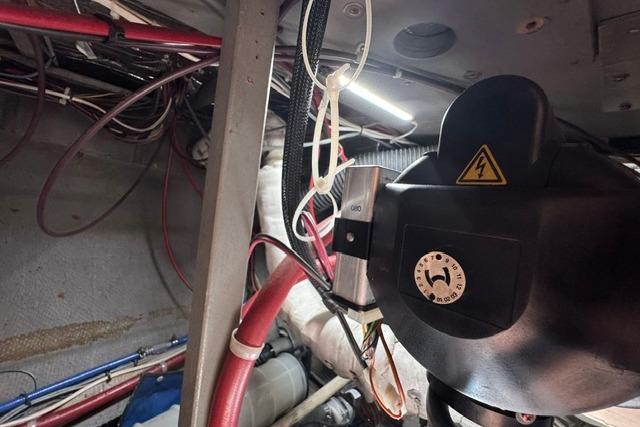 Engine room of a 1984 Tollycraft 43 Motor Yacht with electrical components and wiring.