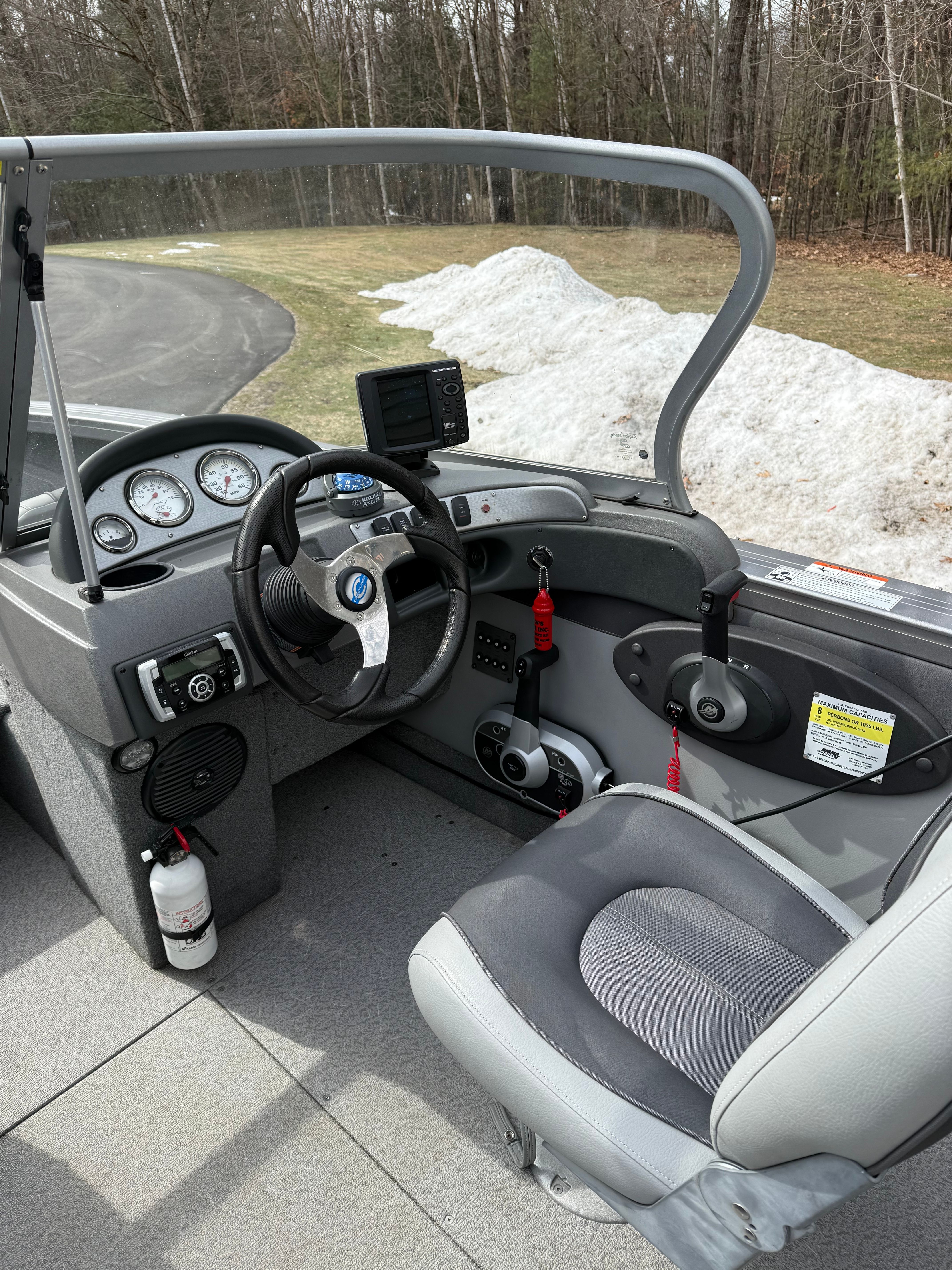Interior of a 2015 Crestliner 1850 boat with steering console.