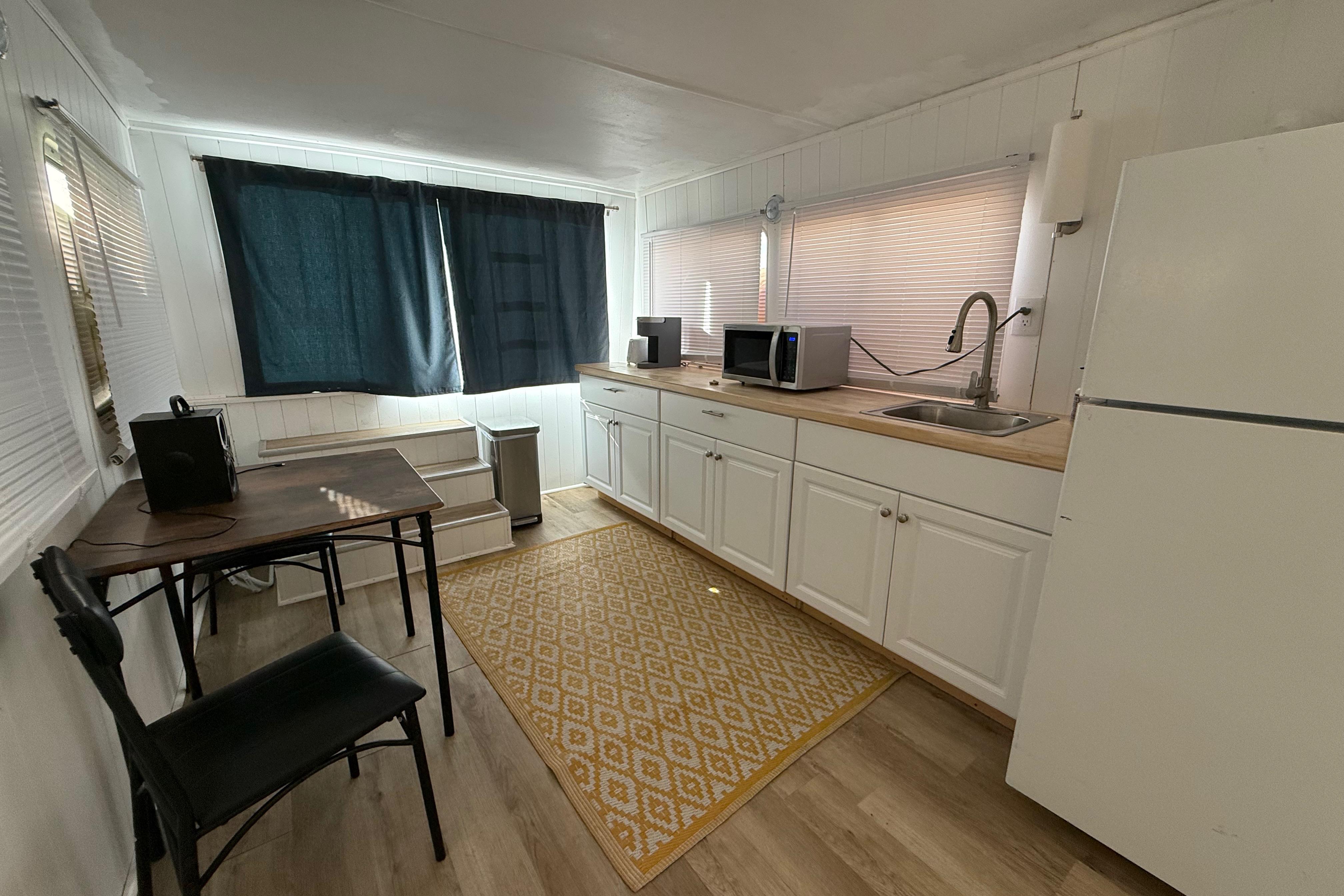 Interior of 1983 Holiday Mansion 37 Barracuda with kitchen and dining area.