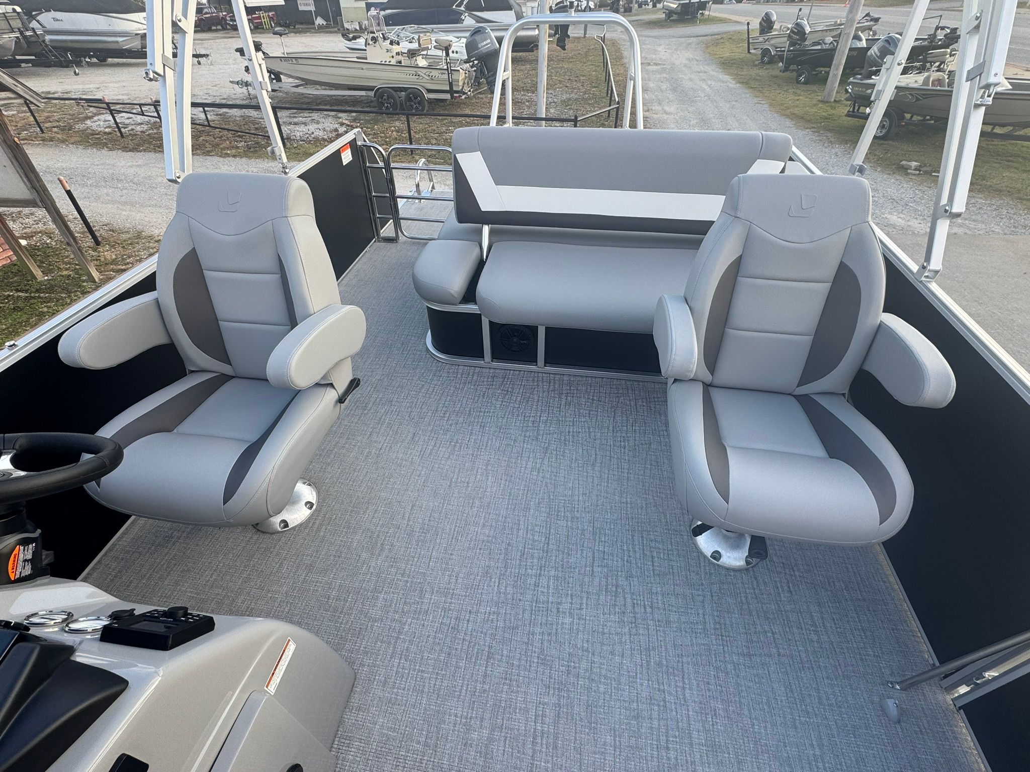 Interior of 2026 Landau 23 Island Breeze with gray seating.