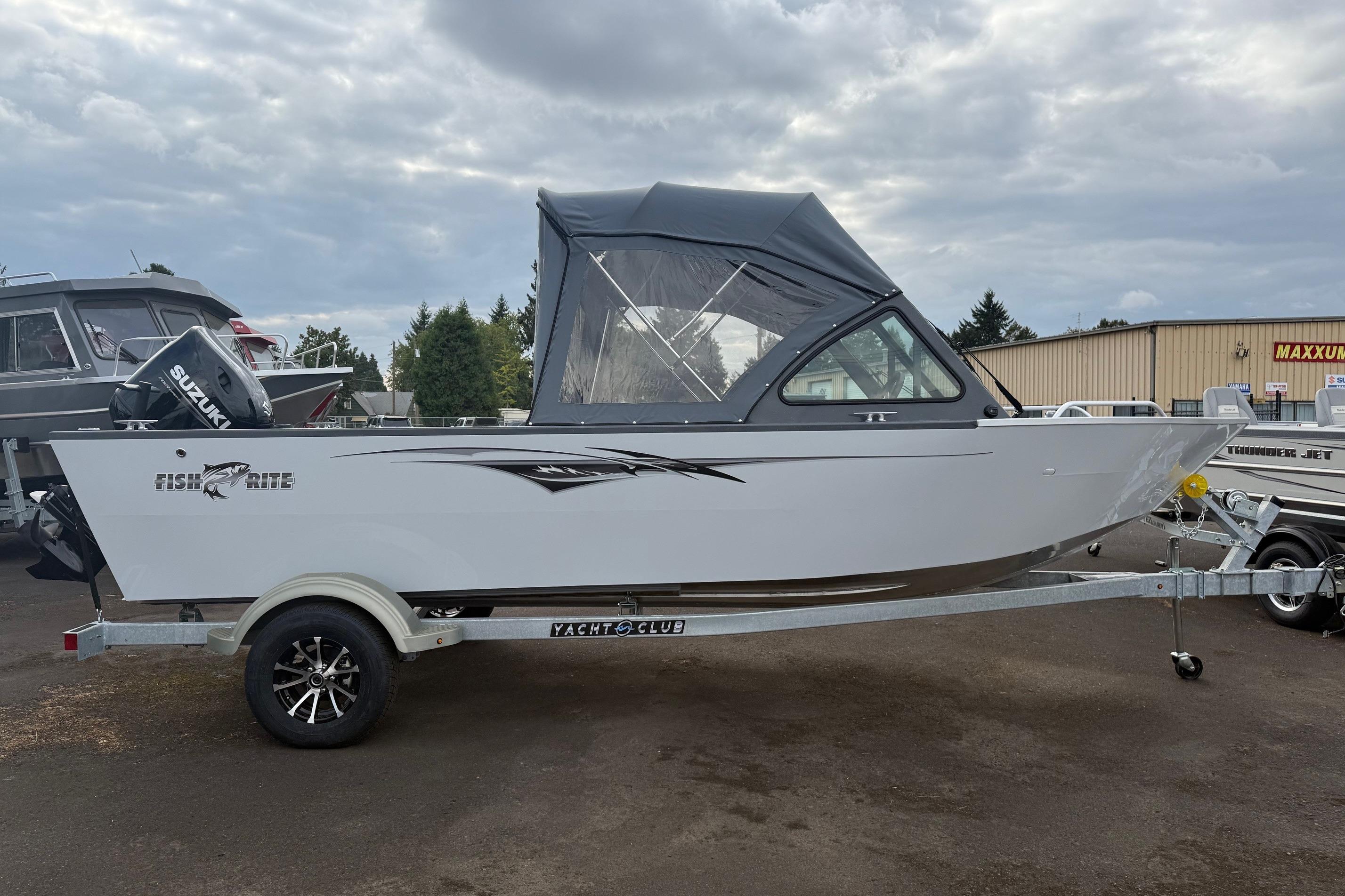 2026 Fish Rite Sportsman 20 boat on trailer, featuring Suzuki outboard motor.