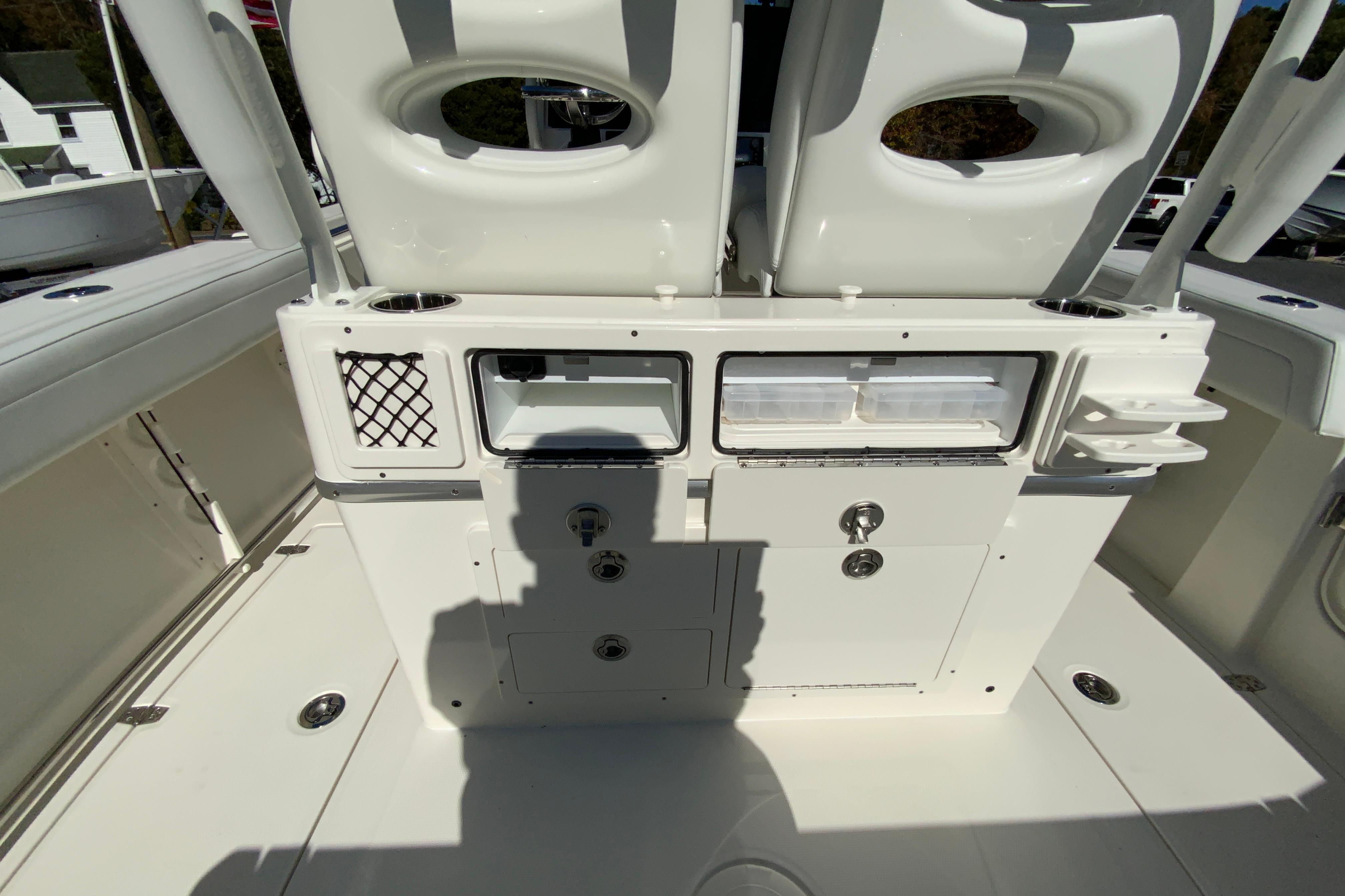 2026 Cobia 265 Center Console boat interior with storage compartments and seating.