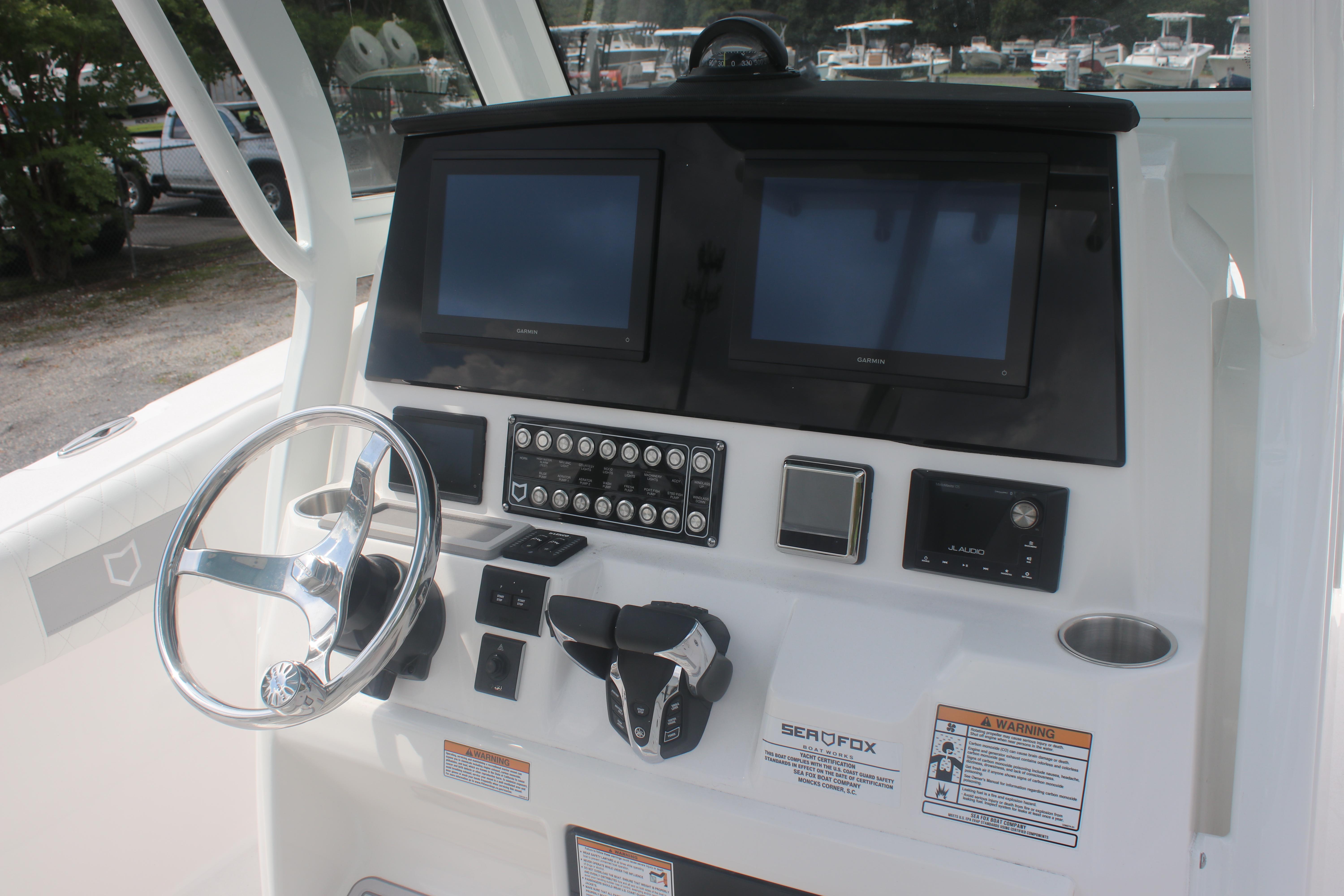 2026 Sea Fox 288 Commander dashboard with dual screens and steering wheel.