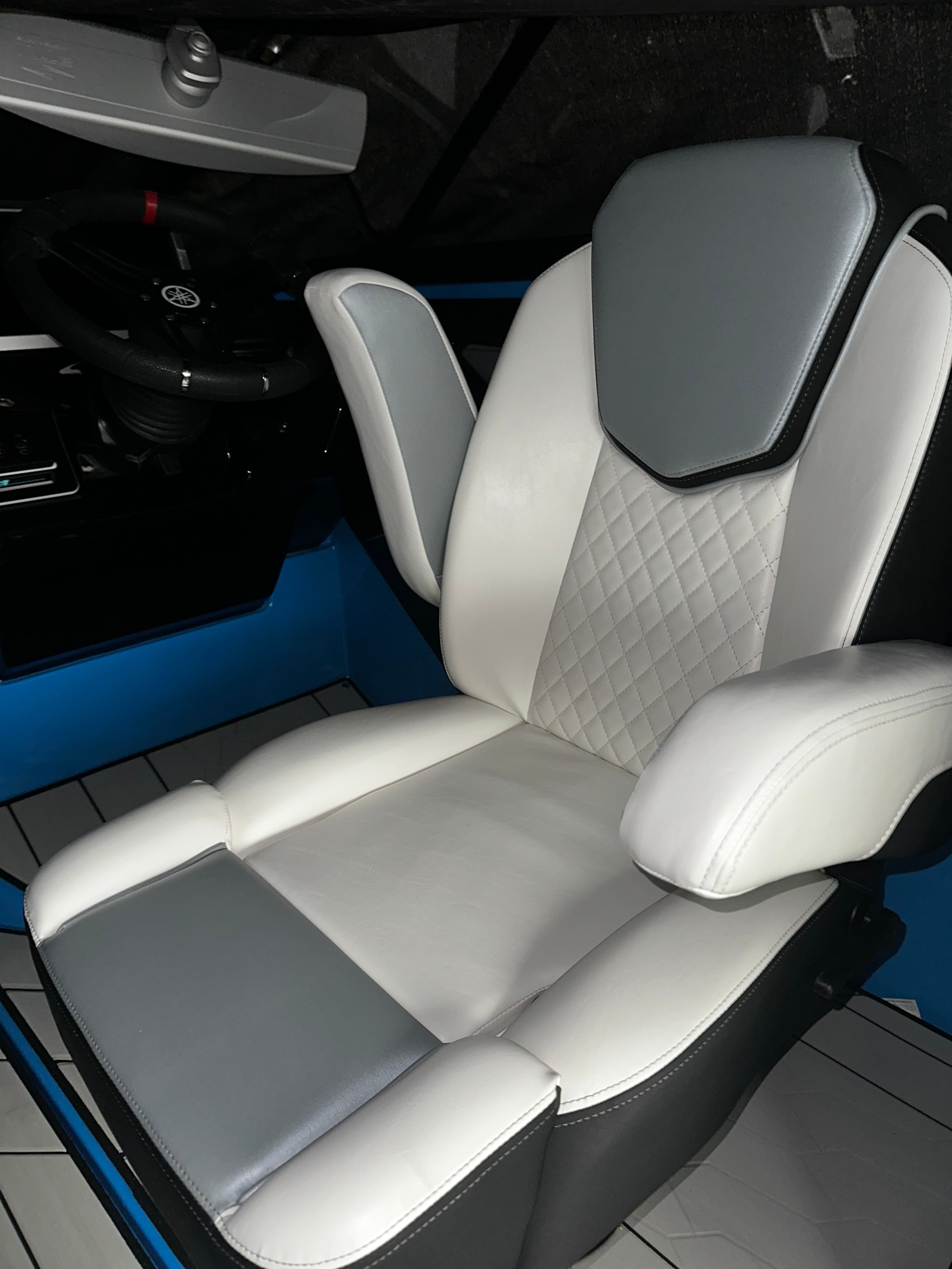 Luxury seating in 2023 Yamaha Boats 255XD, featuring quilted upholstery and ergonomic design.