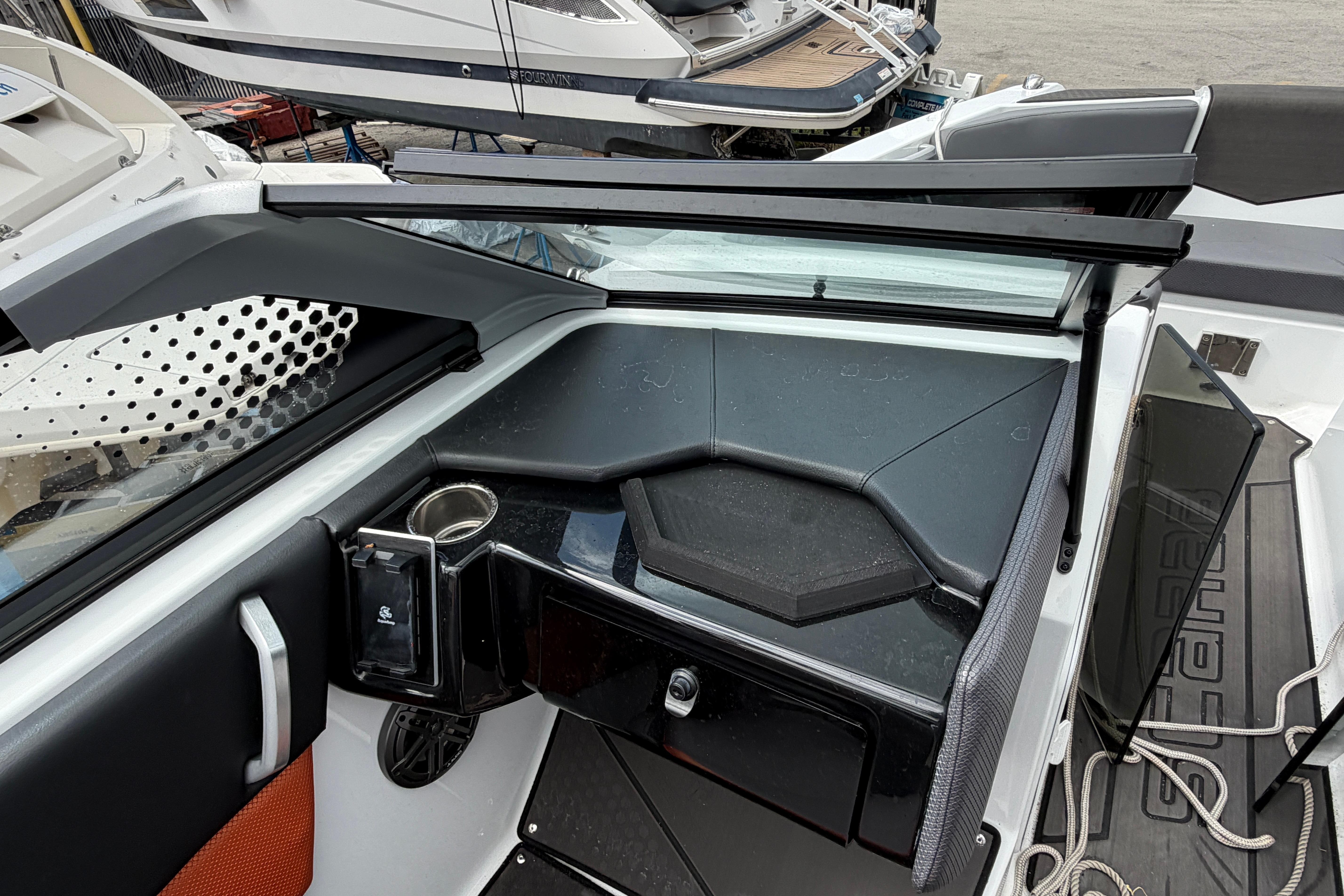 Interior view of 2026 Scarab 235 LX boat, featuring sleek dashboard and modern design elements.