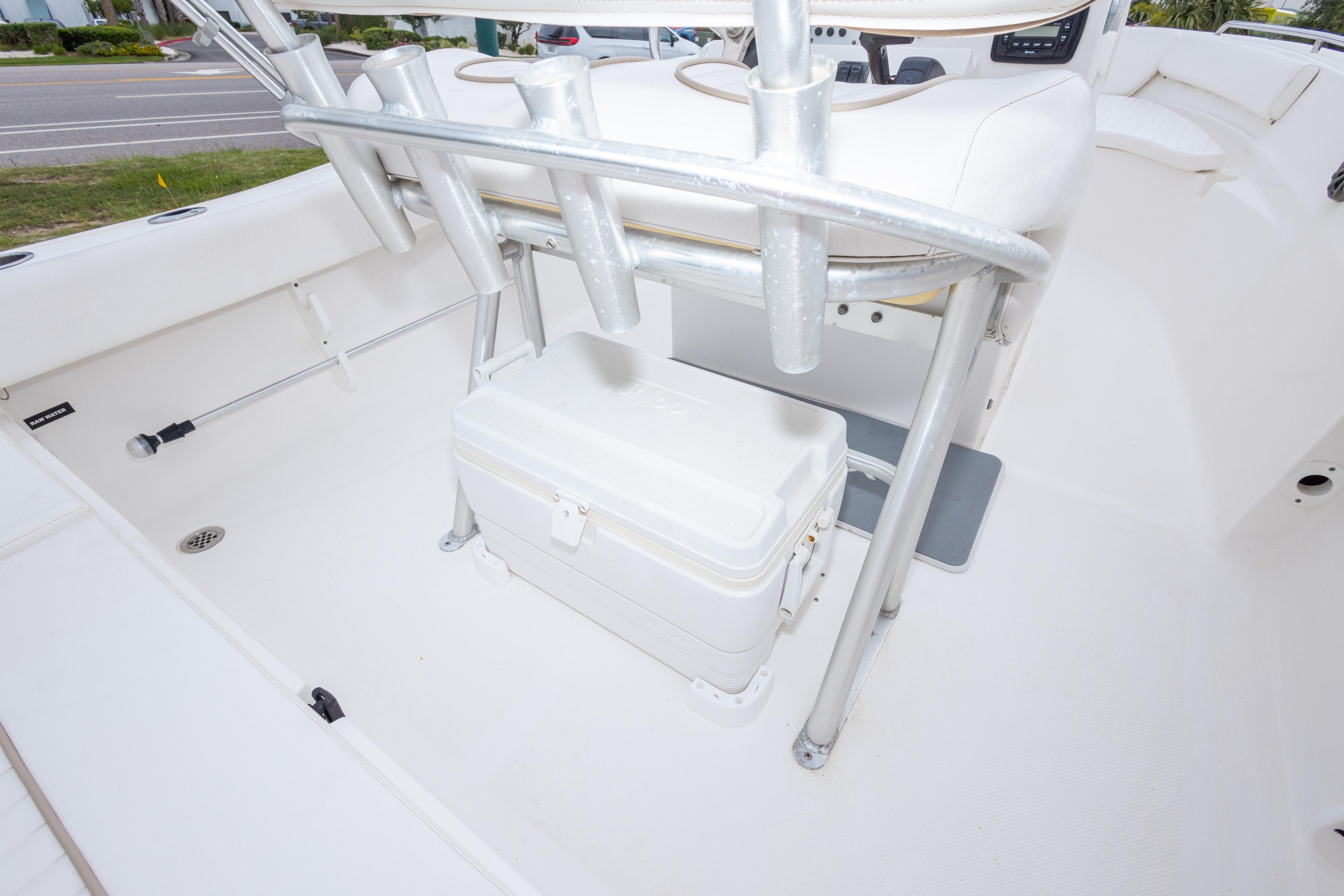 2014 Sea Fox 209 Commander boat interior with cooler and rod holders.