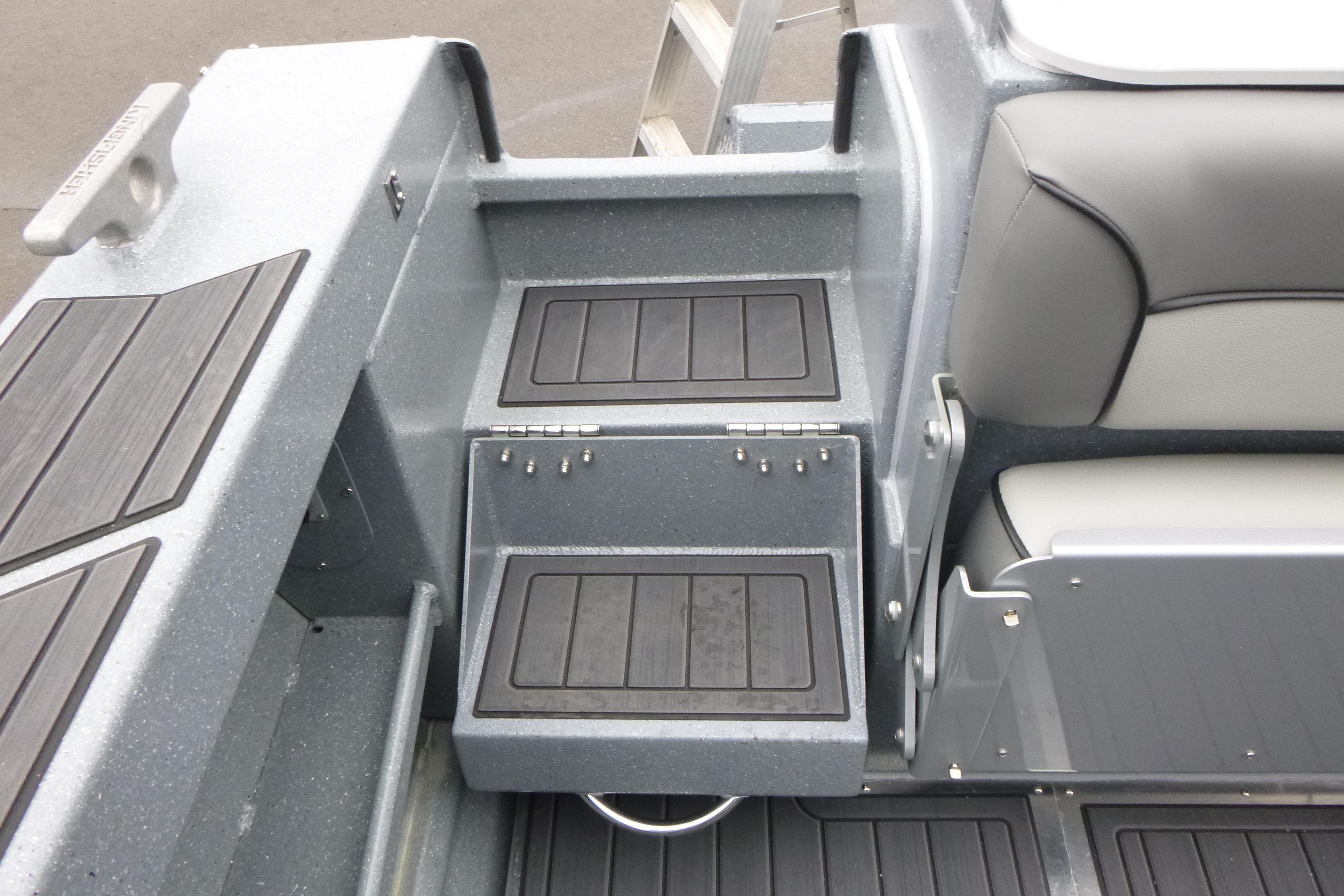 2026 KingFisher 25 XAC boat interior with sleek seating and storage compartments.