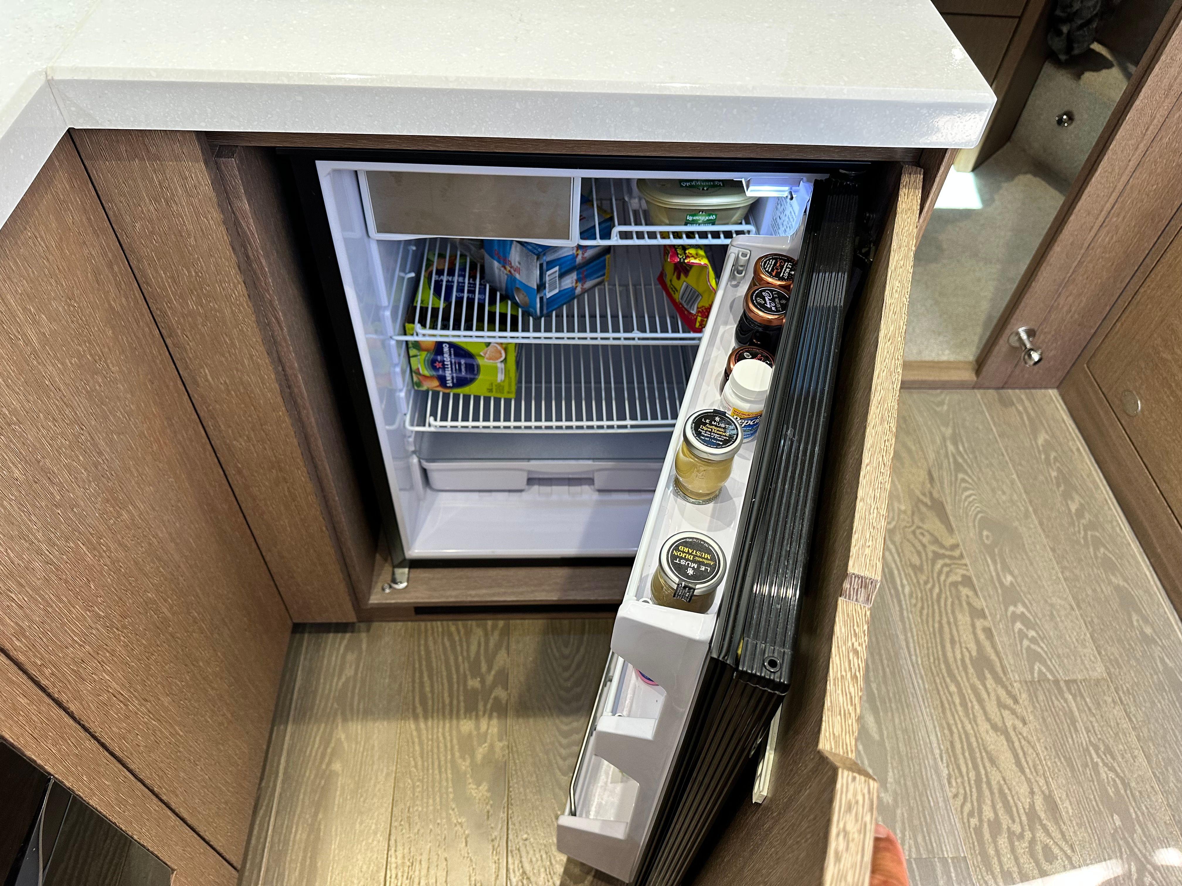 Open fridge in a 2019 Galeon 485 HTS yacht.