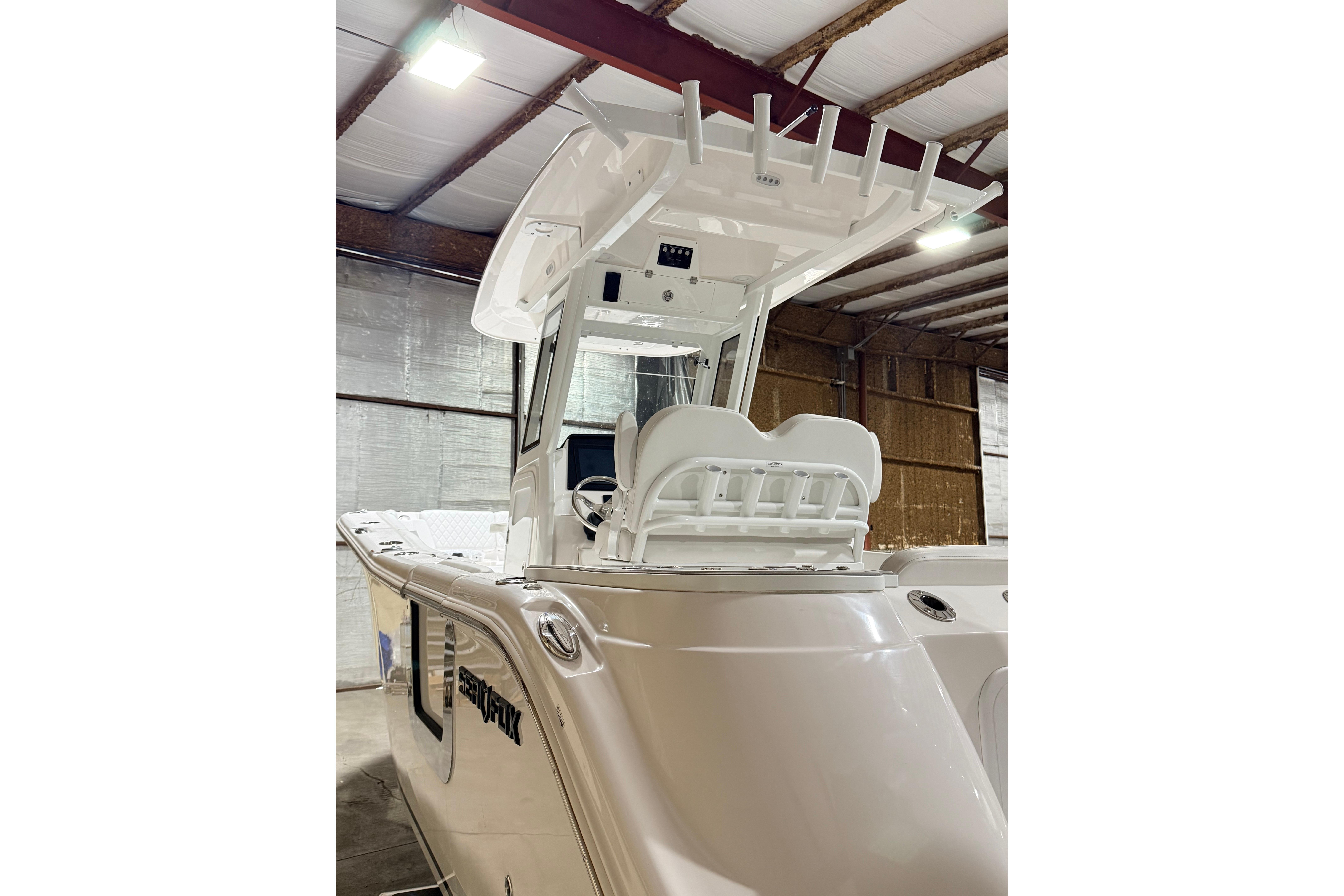 2026 Sea Fox 268 Commander boat in indoor storage, showcasing helm and seating area.
