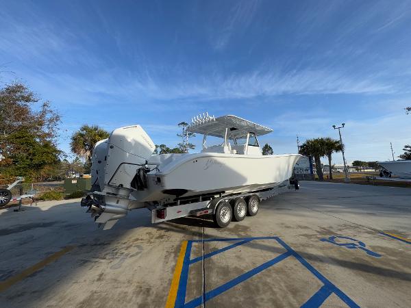 2025 Yellowfin 39 Offshore boat on trailer, parked outdoors under clear blue sky.